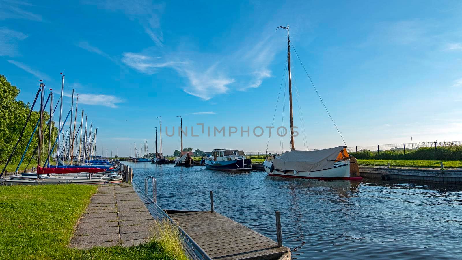 Sailing boats in the harbor in Oudega Friesland in the Netherlands