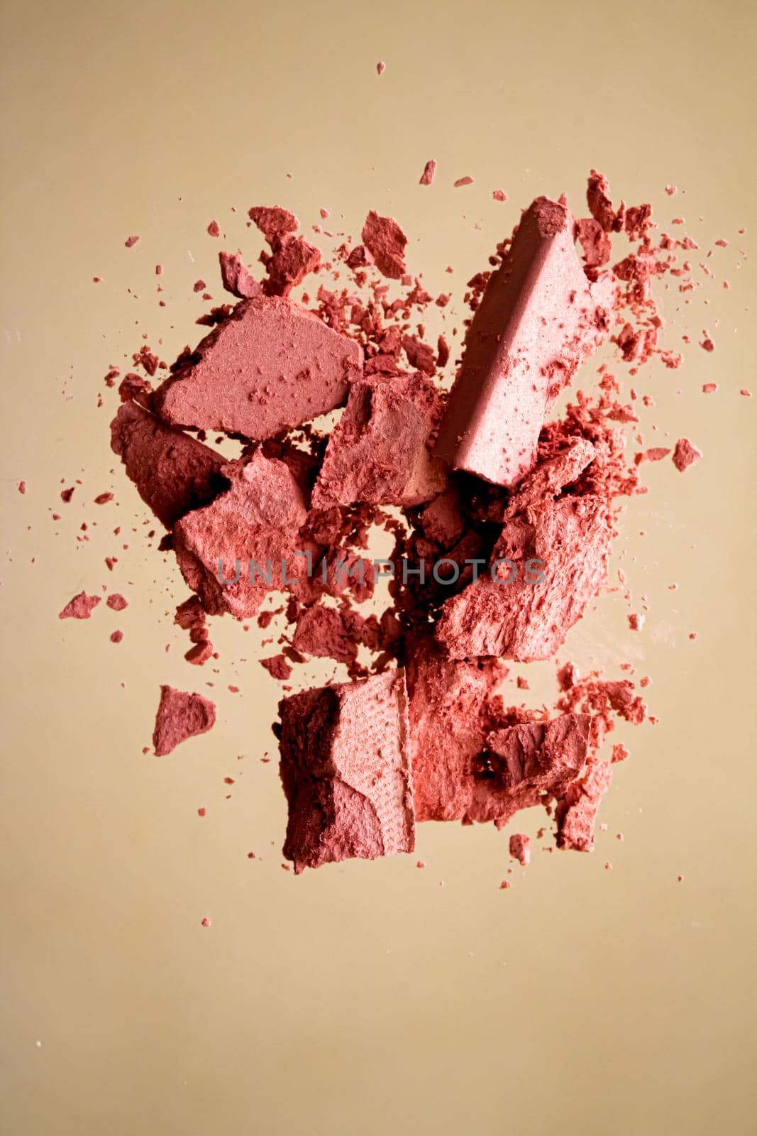 Crushed cosmetics, mineral organic eyeshadow, blush and cosmetic powder isolated on golden background, makeup and beauty banner, flatlay design.