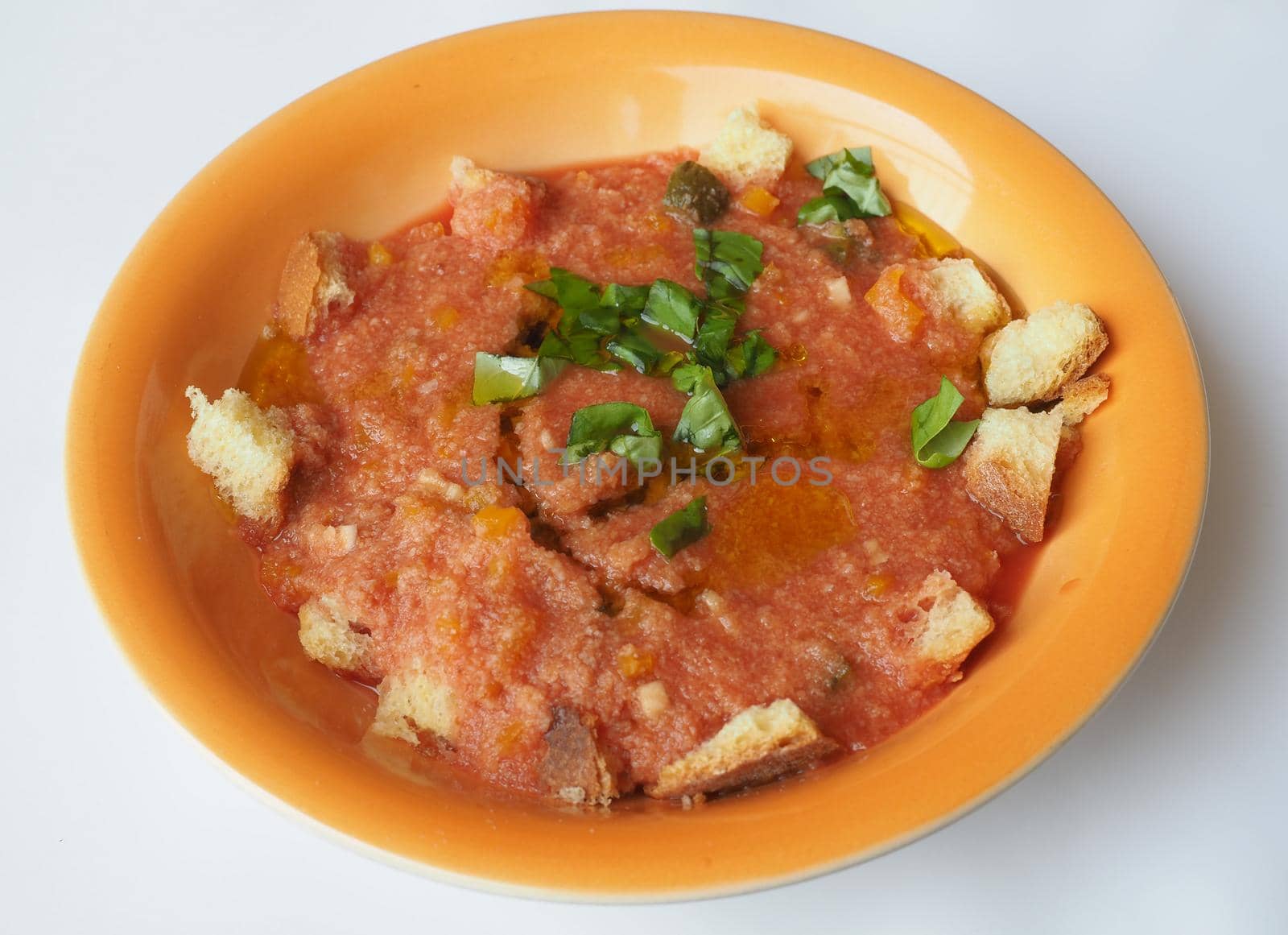 Dish of Spanish gazpacho cold soup made of tomato soup and bread