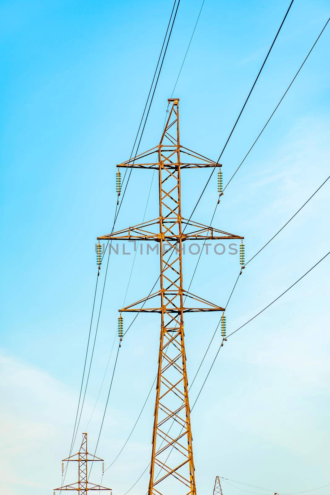 Production of fuel and electricity.Electrical networks with wires and transformers at sunset.Power transmission lines and from the power plant.Power lines with wires under voltage and electric current by YevgeniySam