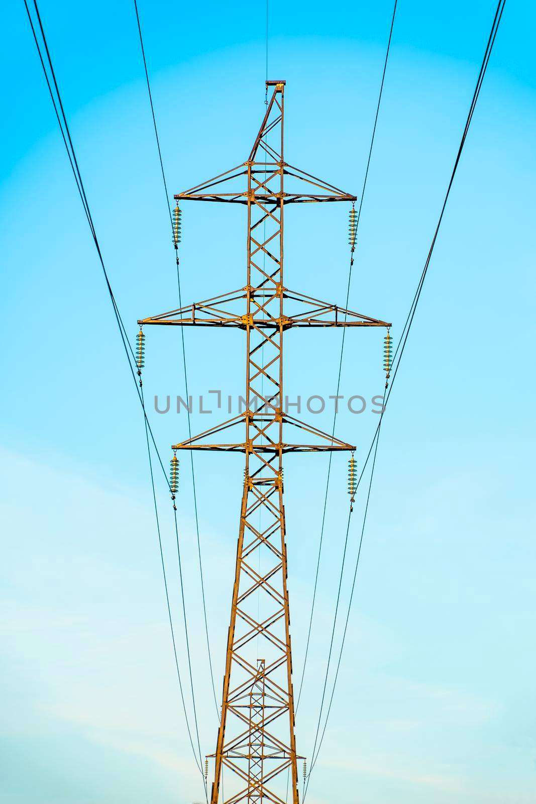 Production of fuel and electricity.Electrical networks with wires and transformers at sunset.Power transmission lines and from the power plant.Power lines with wires under voltage and electric current