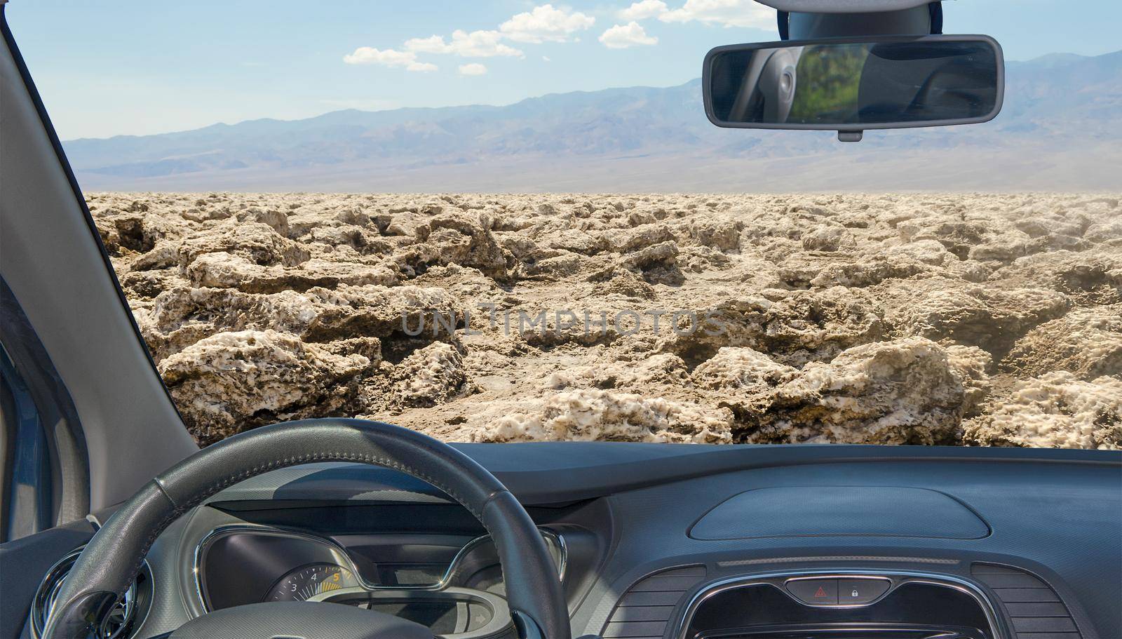 Looking through a car windshield with view of Devil's Golf Course, Death Valley, USA
