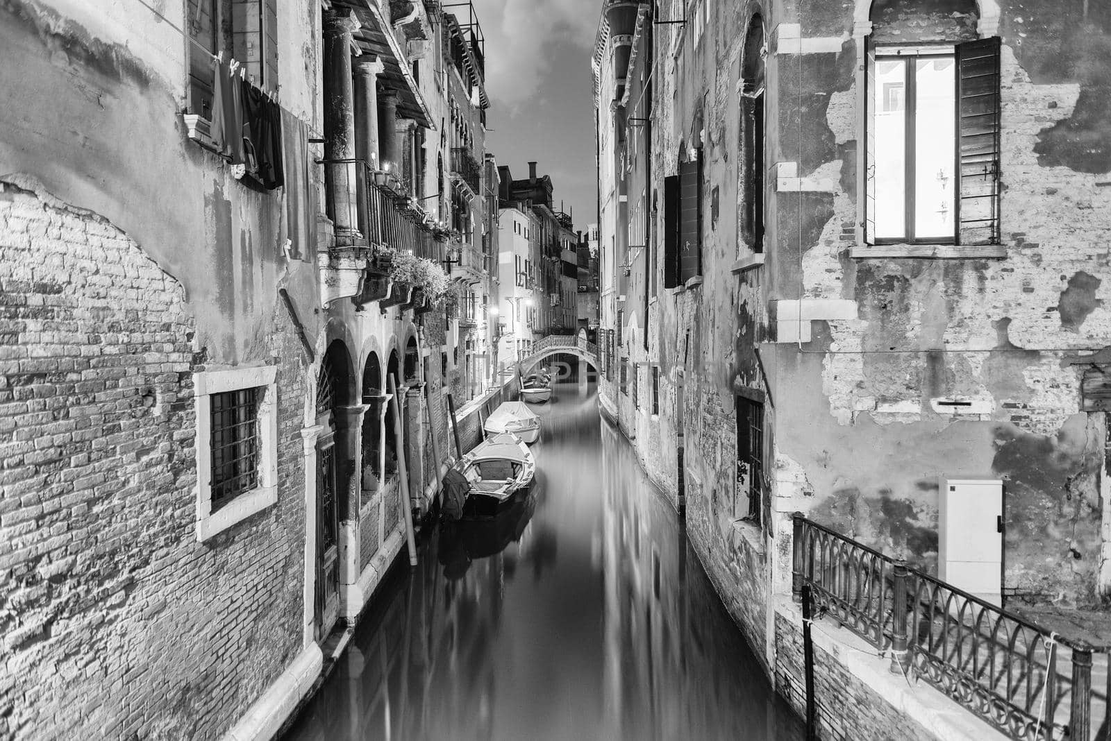 View over a picturesque canal at night, Venice, Italy by marcorubino