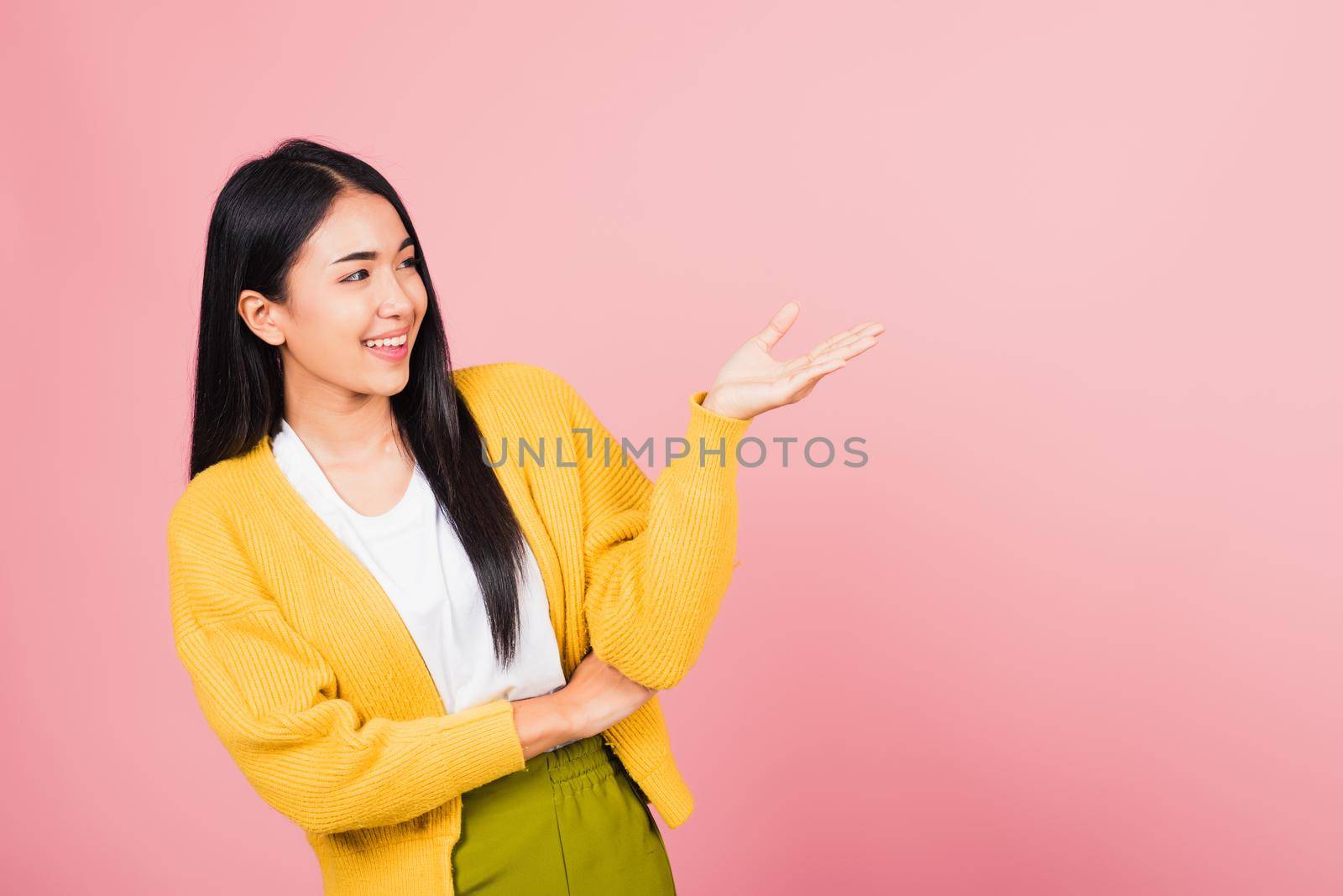 woman smile standing presenting product holding something on palm away side by Sorapop