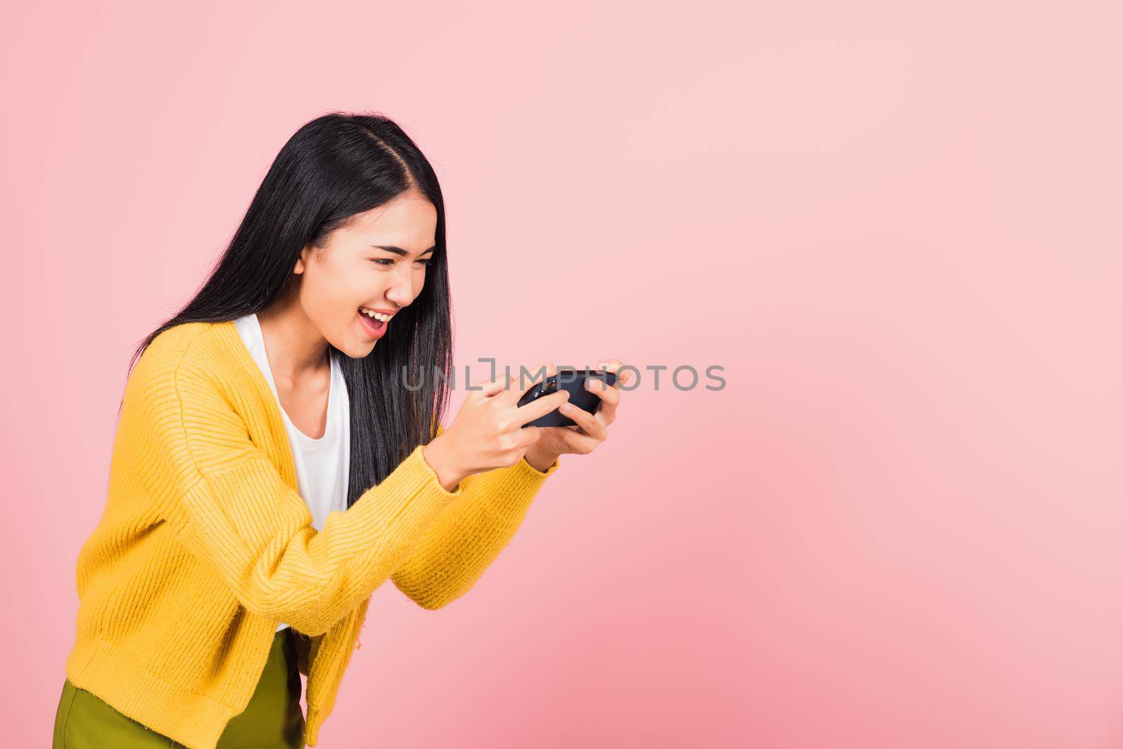 woman teen smiling excited   using mobile phone say yes!  by Sorapop