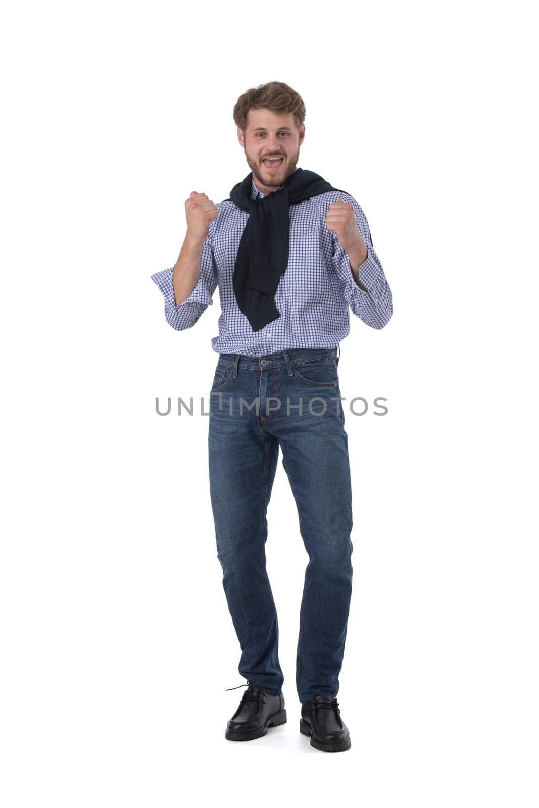 Full length portrait of a happy man with yes gesture holding fists