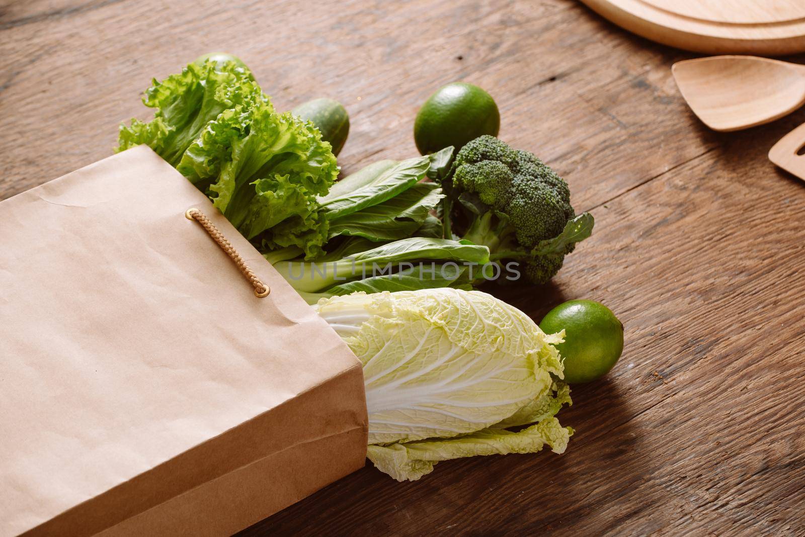 fresh vegetables in a brown paper bag by makidotvn