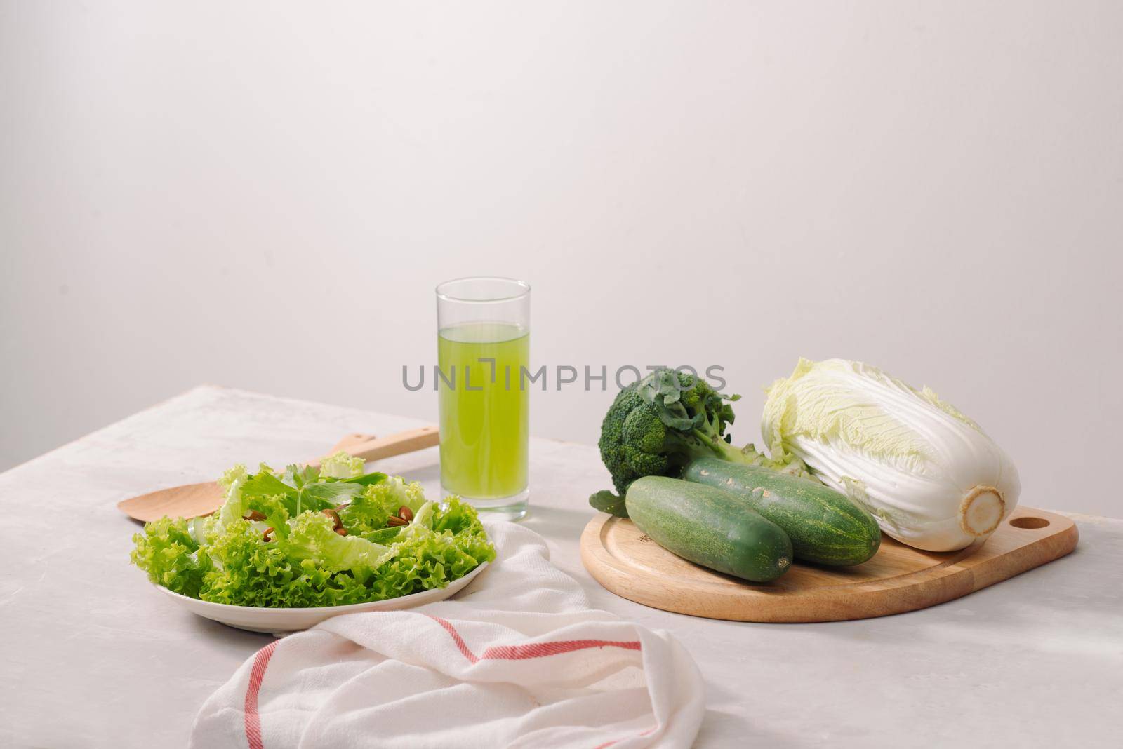 Various green organic salad ingredients on white background. Healthy lifestyle or detox diet food concept