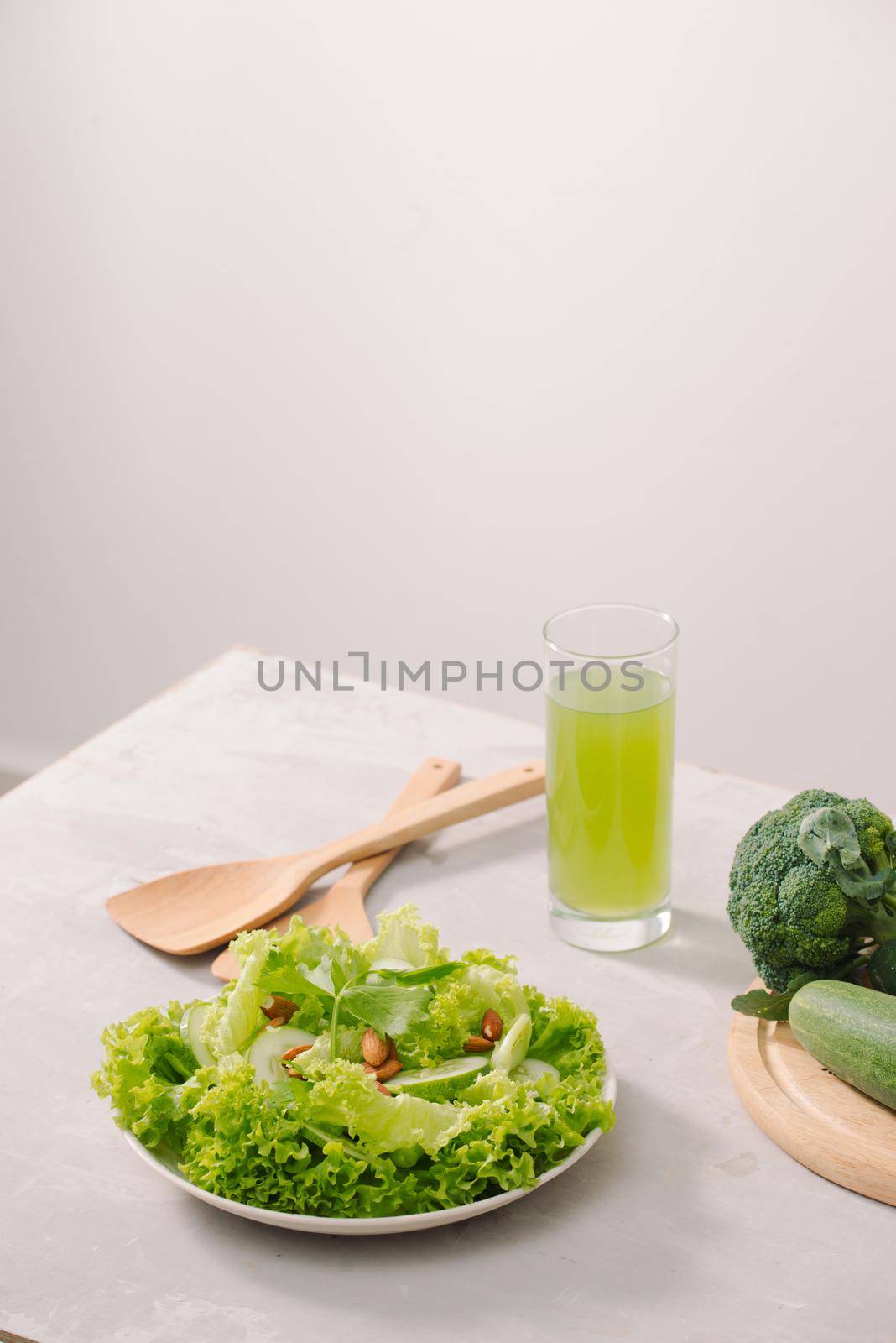 Various green organic salad ingredients on white background. Healthy lifestyle or detox diet food concept