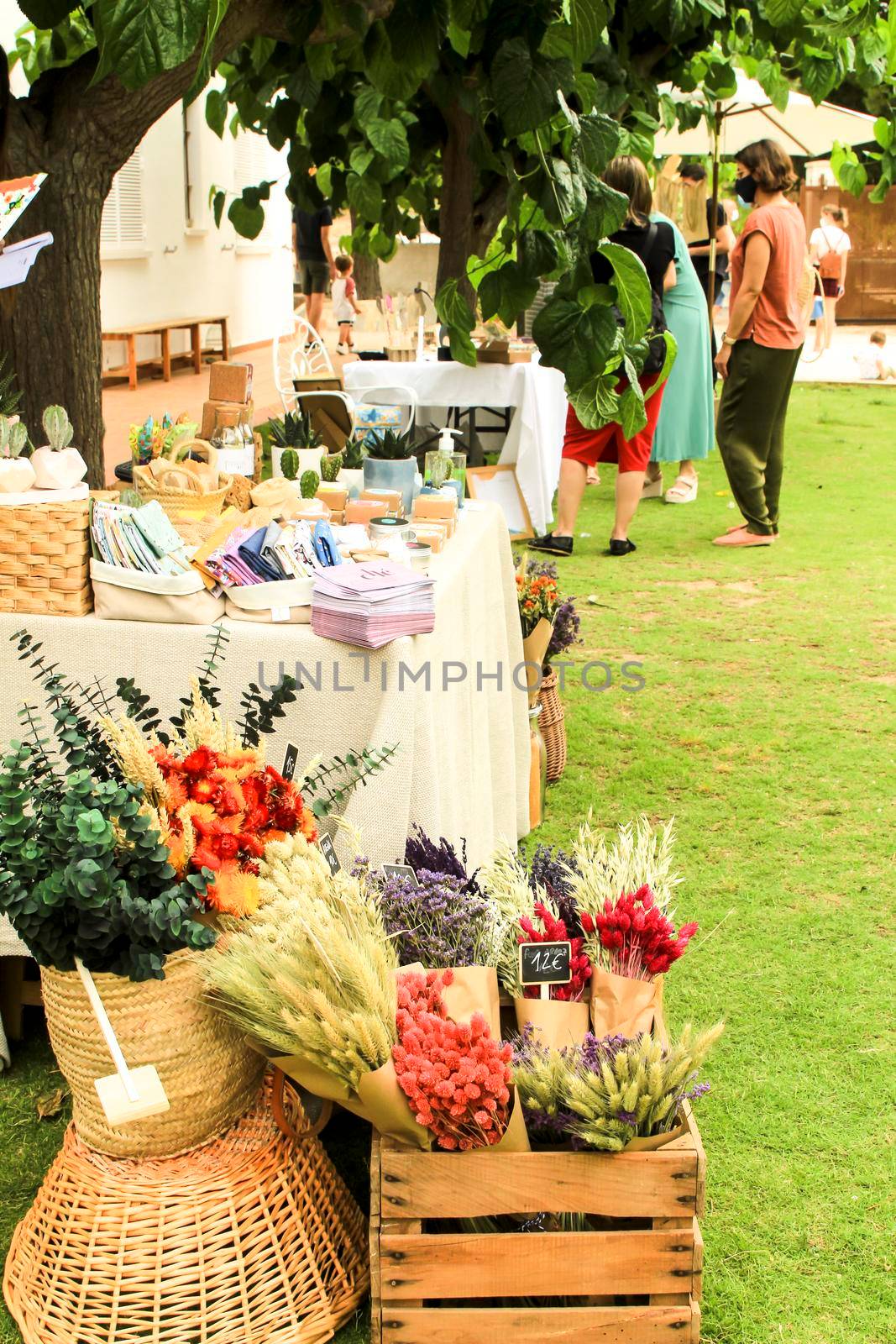 Elche, Alicante, Spain- June 19, 2021: Beautiful bouquets of dry flowers for sale at a market stall in Spain