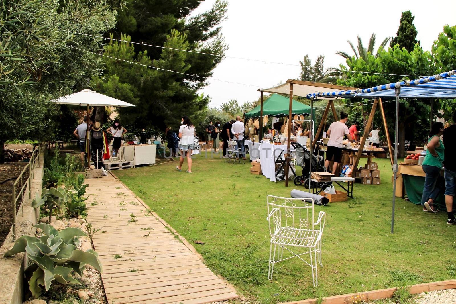 Elche, Alicante, Spain- June 20, 2021: Ecological, secondhand and sustainable market held in a rural setting in the countryside of Elche