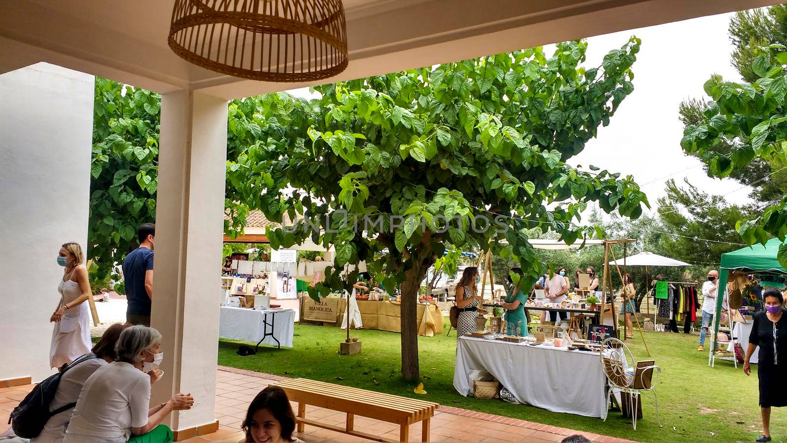 Elche, Alicante, Spain- June 20, 2021: Ecological, secondhand and sustainable market held in a rural setting in the countryside of Elche