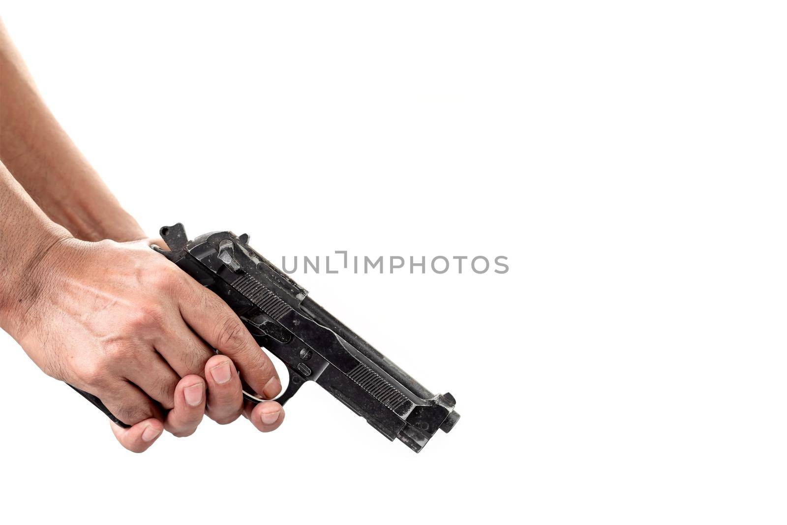 Close-up of a man's hand inspecting and checking a gun with a loaded magazine over white background.