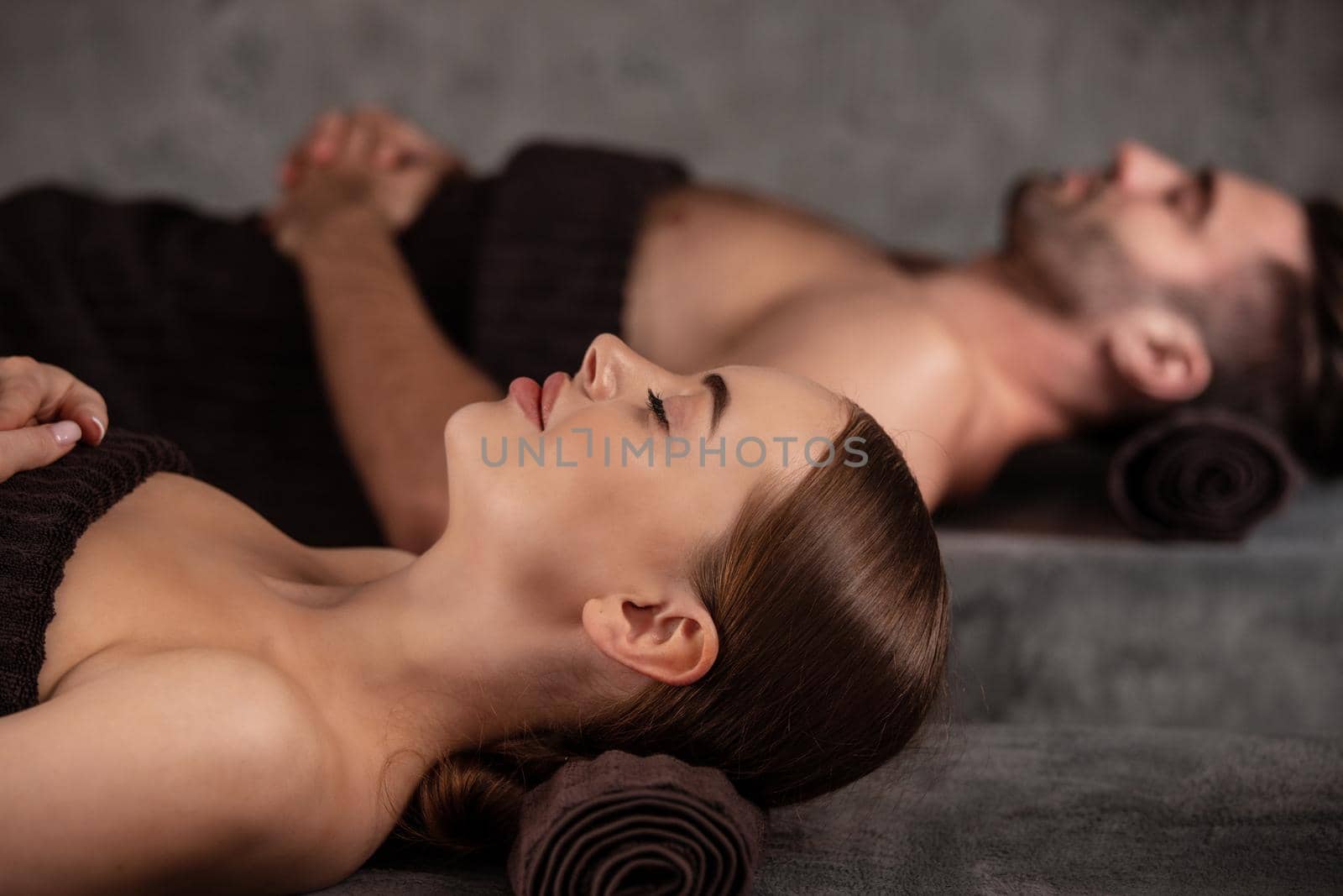 Couple relaxing together at spa centre by ALotOfPeople