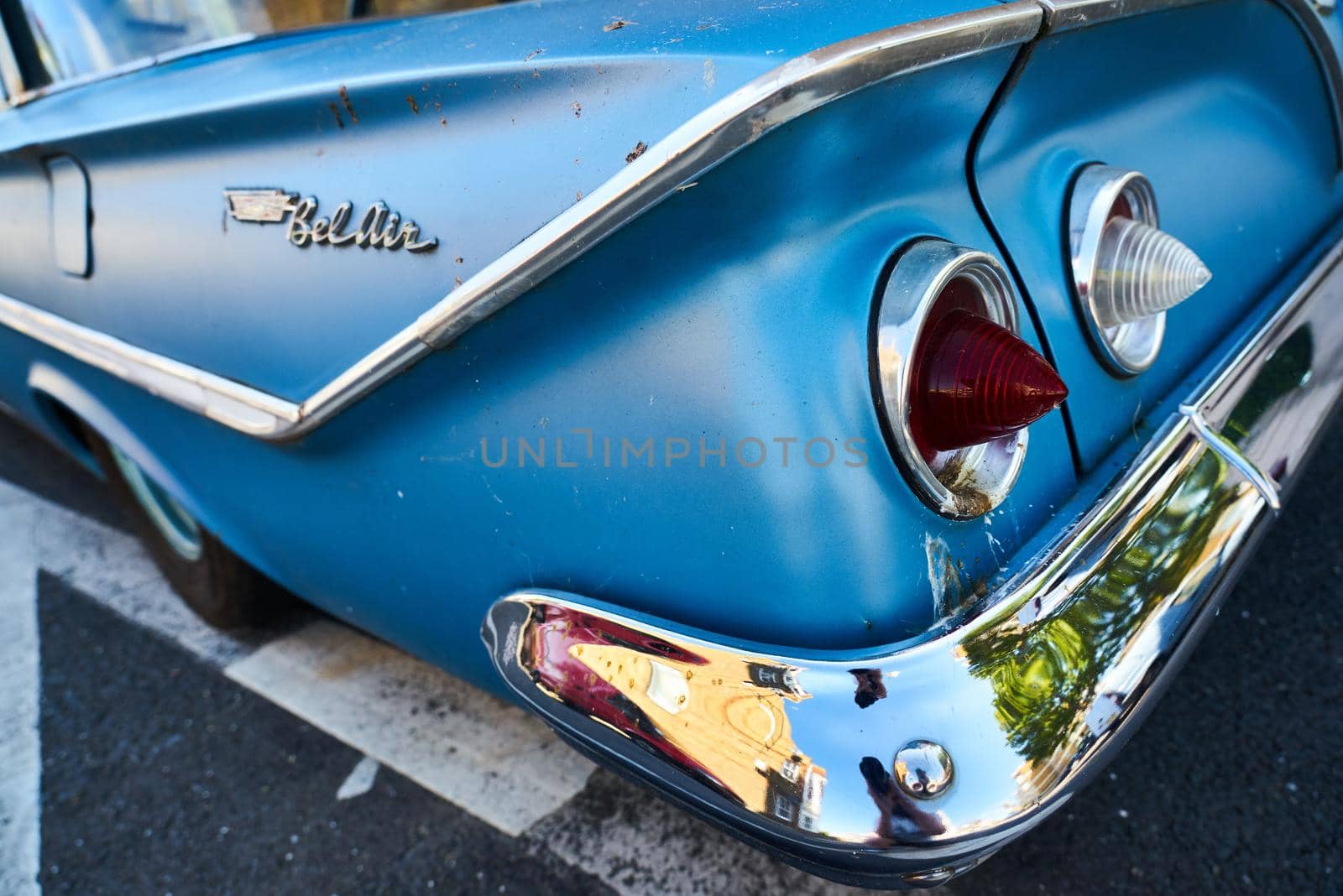 Detail of the tail lights on a blue 1961 4 door Chevrolet Bel Air sedan