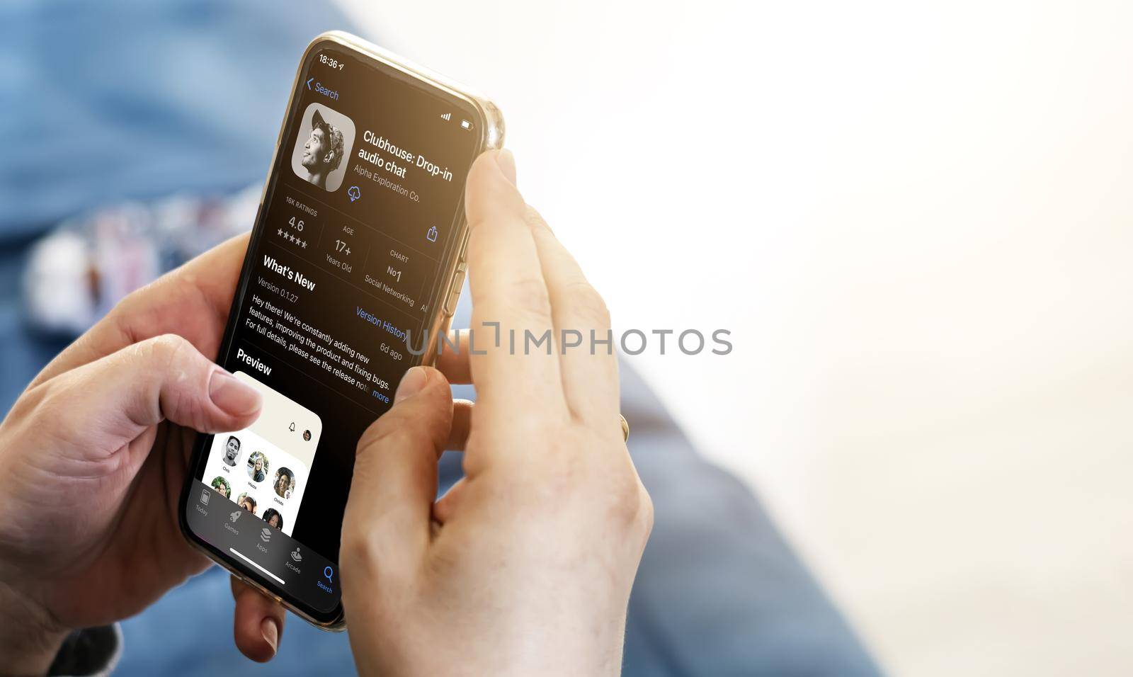 Rome, Italy, June 16th 2021: Woman holding a smart phone with Clubhouse social app login page on screen. Social network and internet.