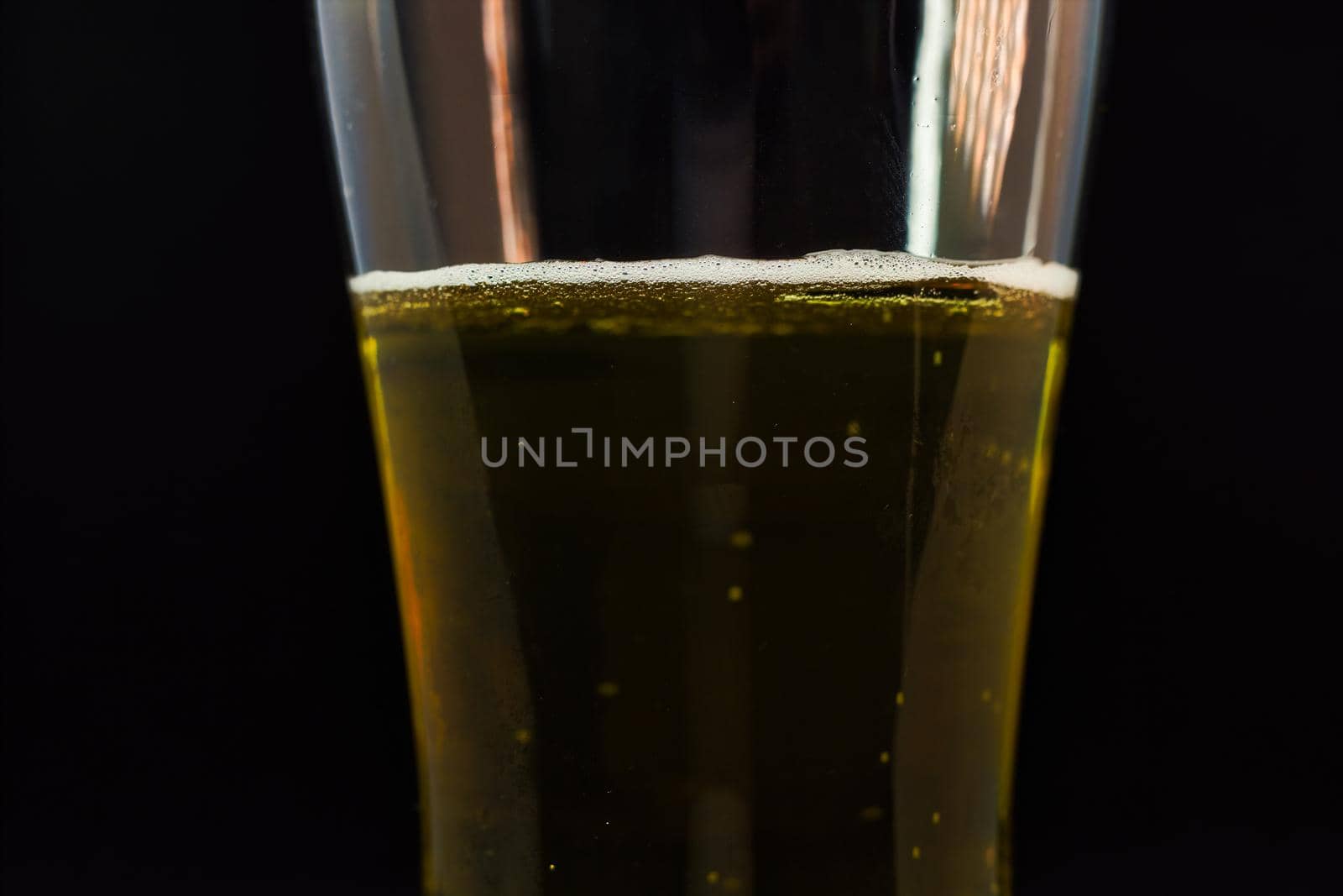 Close-up of beer pint with free space for text. Abstract beverages background by arpanbhatia