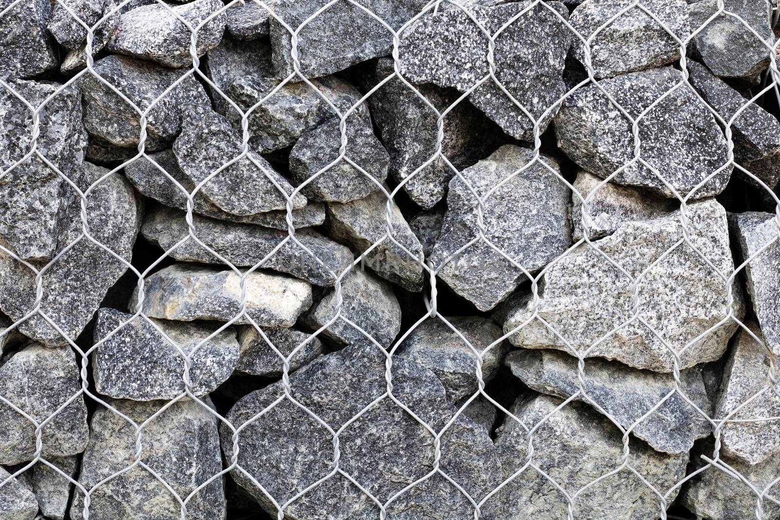 Drainage from stones and mesh. Gabion.