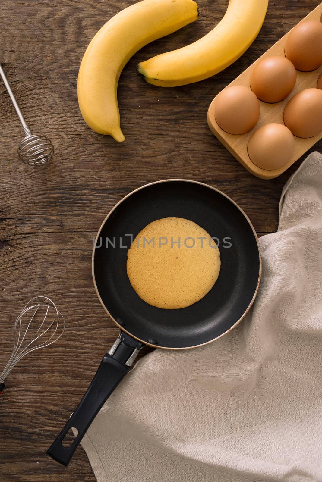 Stack of pancakes on a cast-iron frying pan. Top view. Flat lay by makidotvn