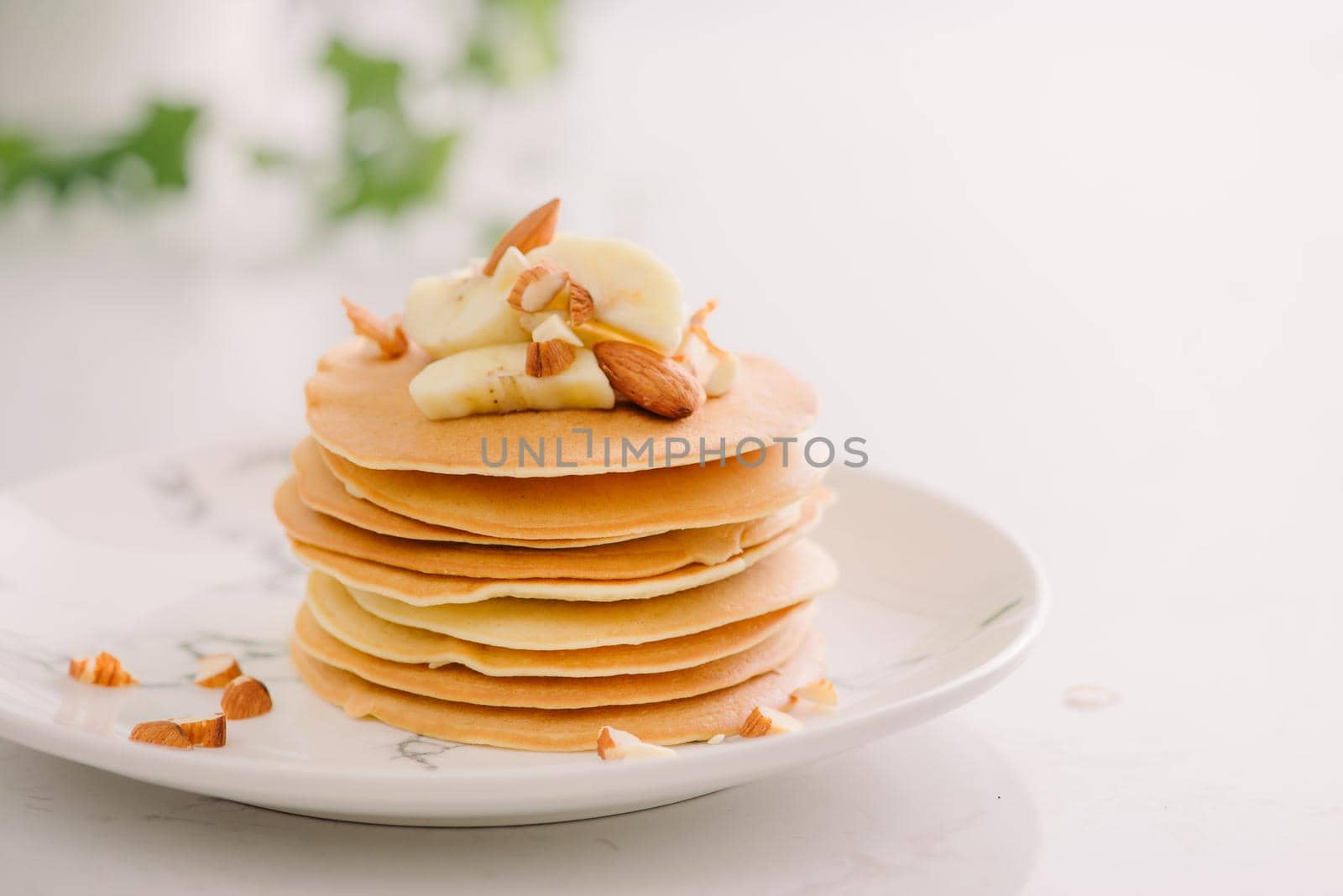 banana cashew pancakes with bananas and salted caramel sauce. the toning. selective focus