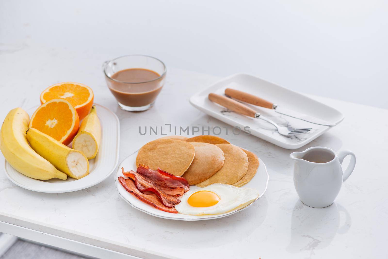 Healthy Full American Breakfast with Eggs Bacon and Pancakes by makidotvn