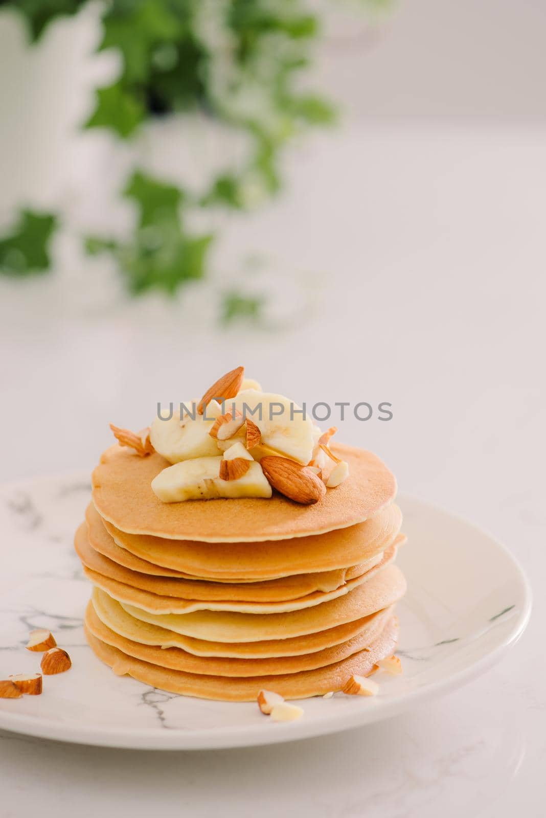 banana cashew pancakes with bananas and salted caramel sauce. the toning. selective focus