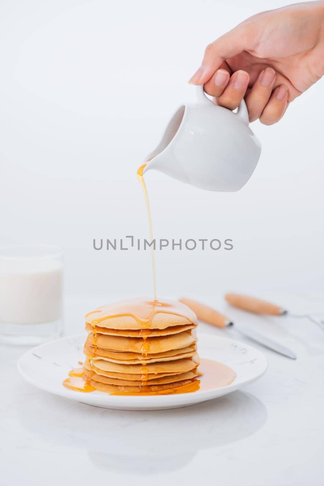 Sweet Homemade Stack of Pancakes with Butter and Syrup for Breakfast by makidotvn