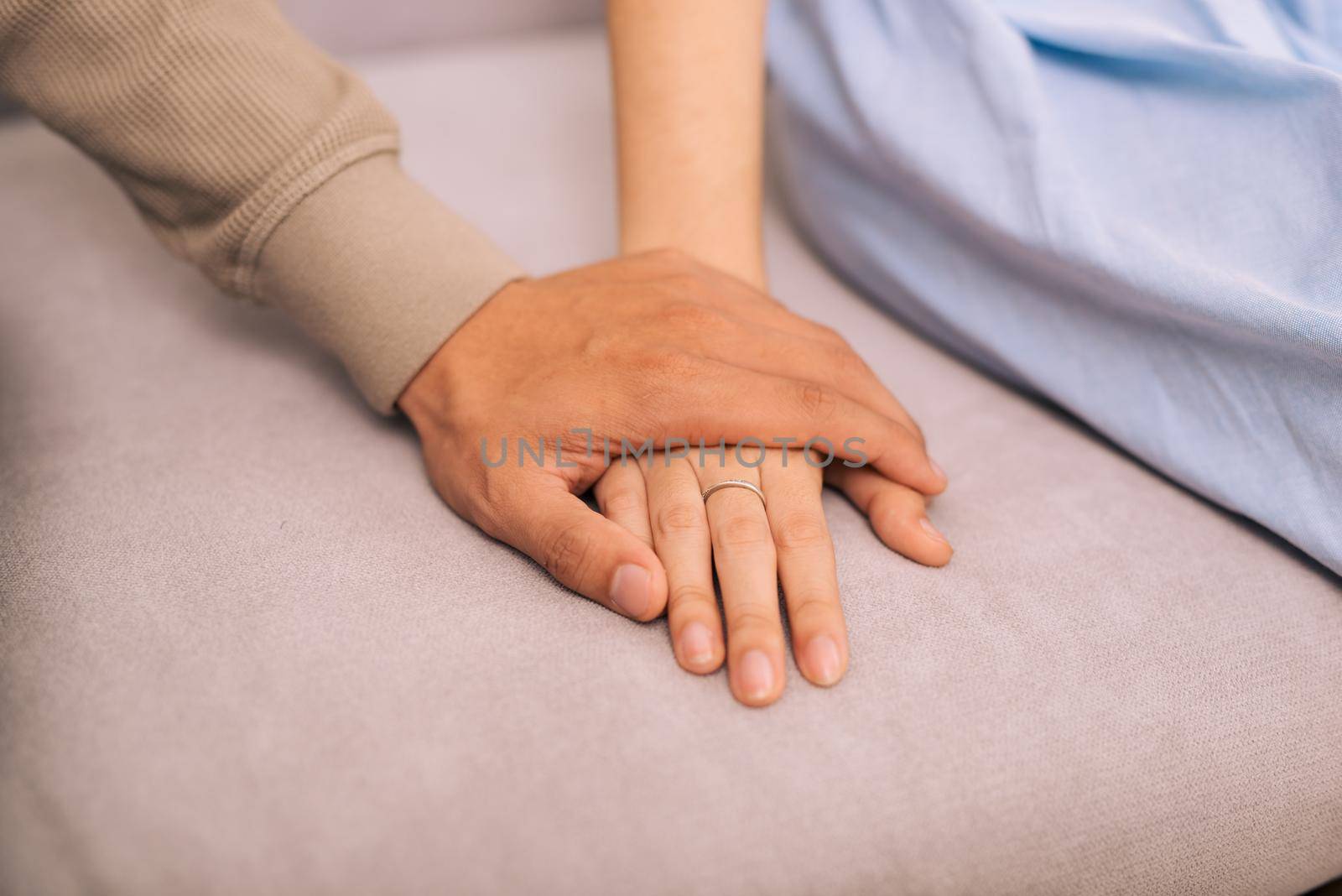 Couple in love. Man and woman holding hands together 