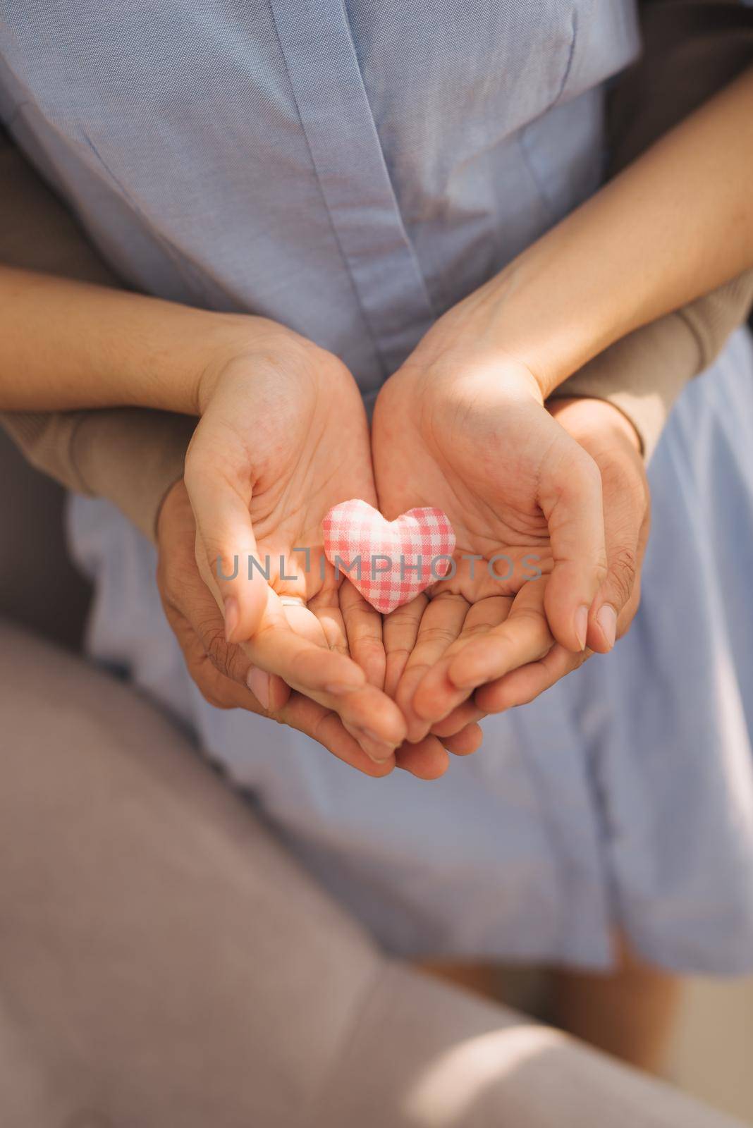 Couple in love. Man and woman hand holding heart shape.
