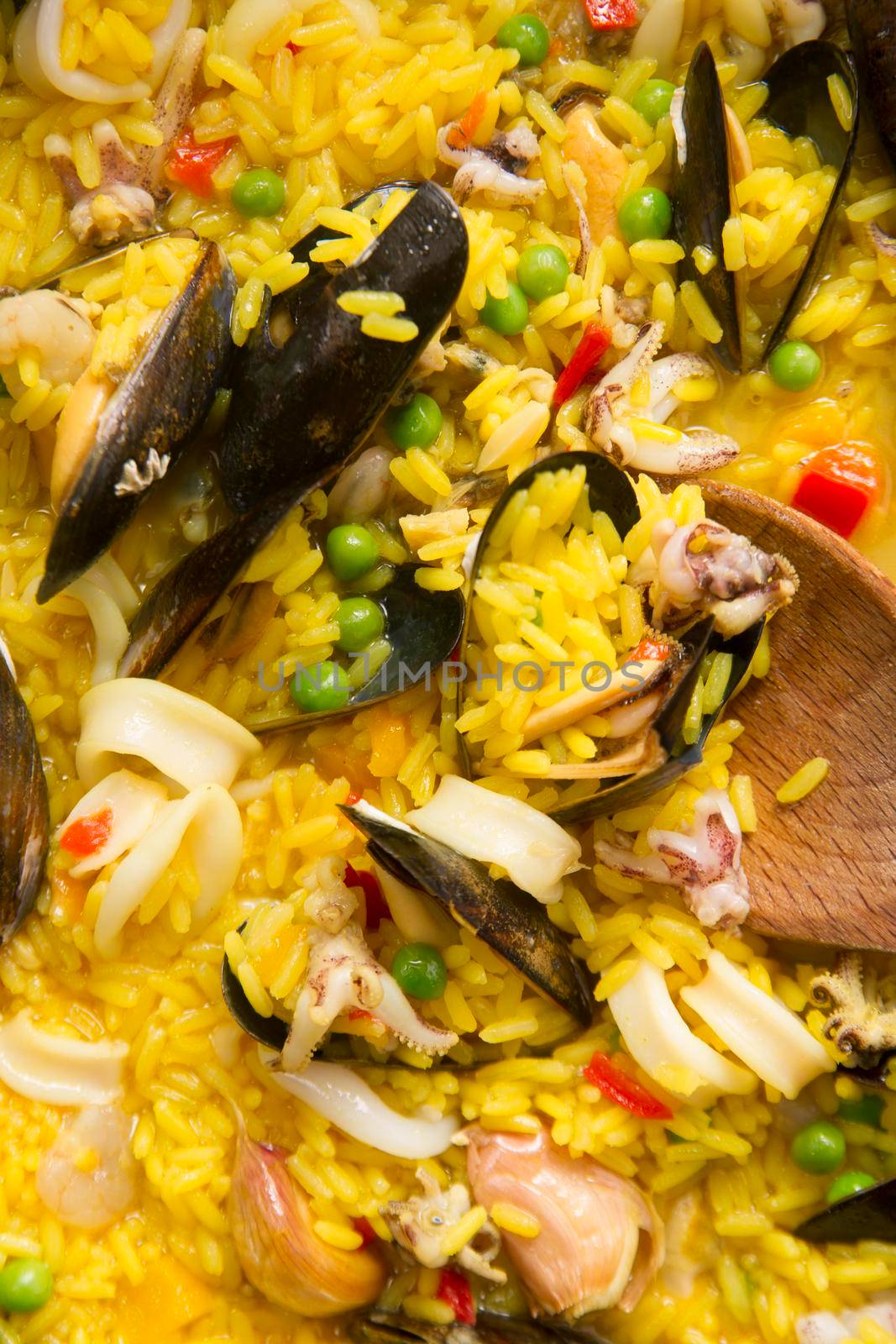 Presentation of a dish of Spain, paella being cooked
