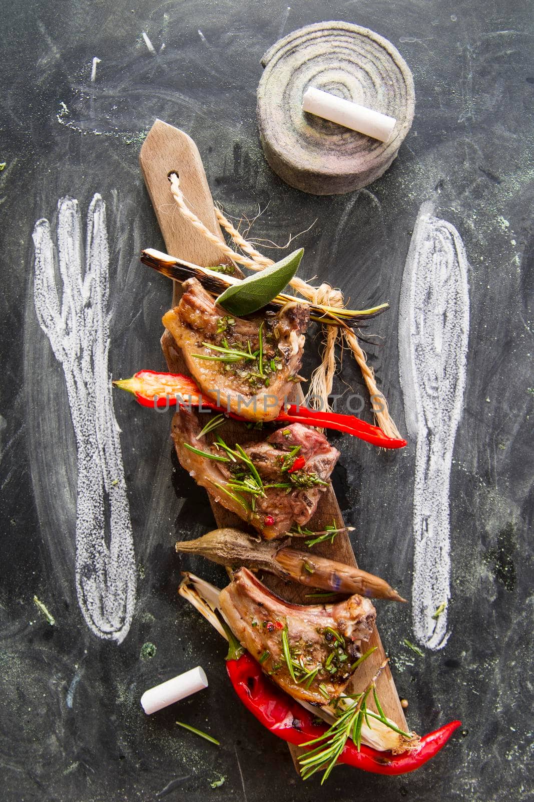 Lamb chops cooked on the grill with leek and red pepper