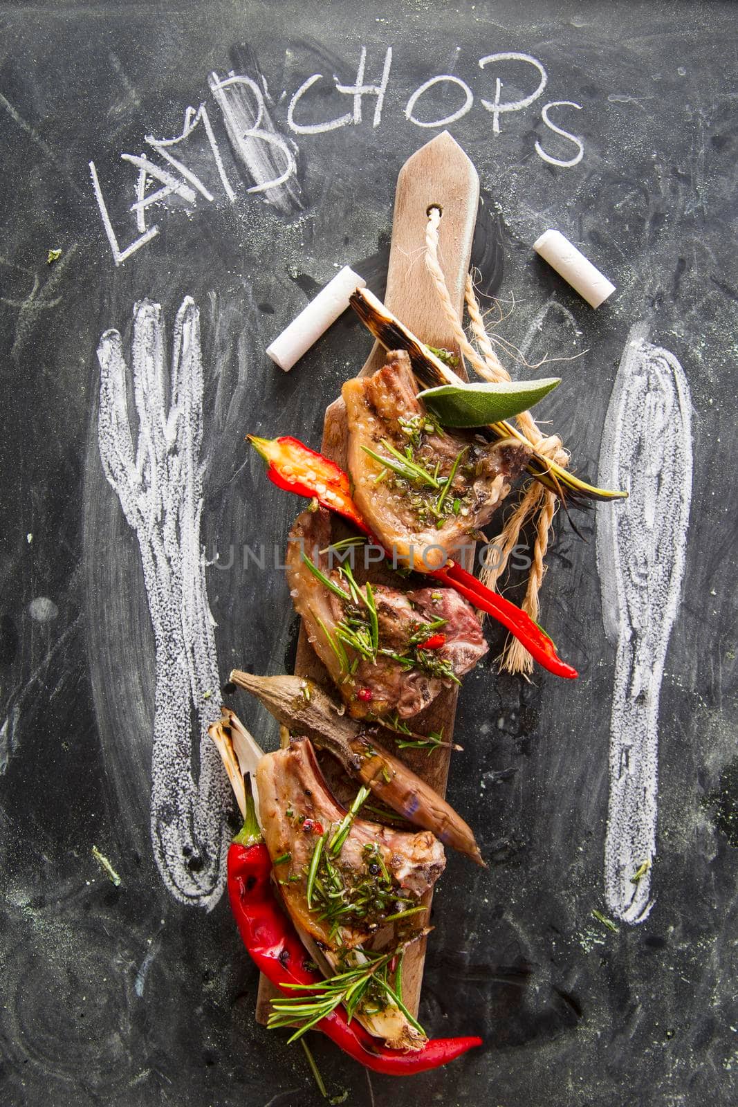 Lamb chops cooked on the grill with leek and red pepper