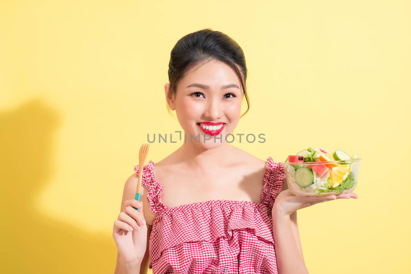 Asian beautiful woman summer outfit posing with fresh bowl of salad by makidotvn