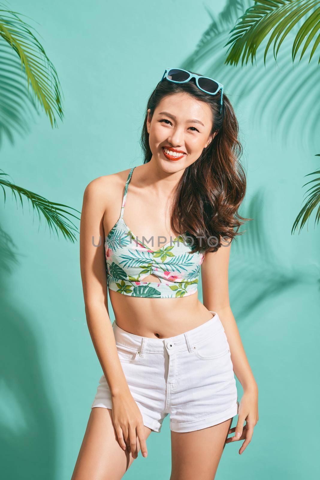 Portrait beauty asian model wearing glasses and crop top in summer time by makidotvn