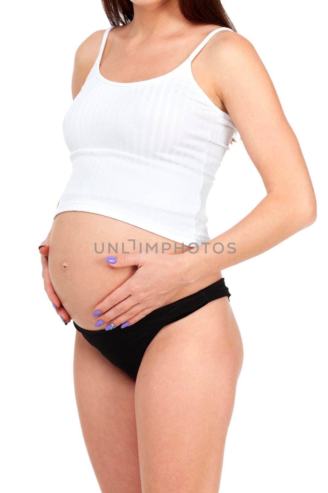 Pregnant woman posing against white background, isolated by Nobilior