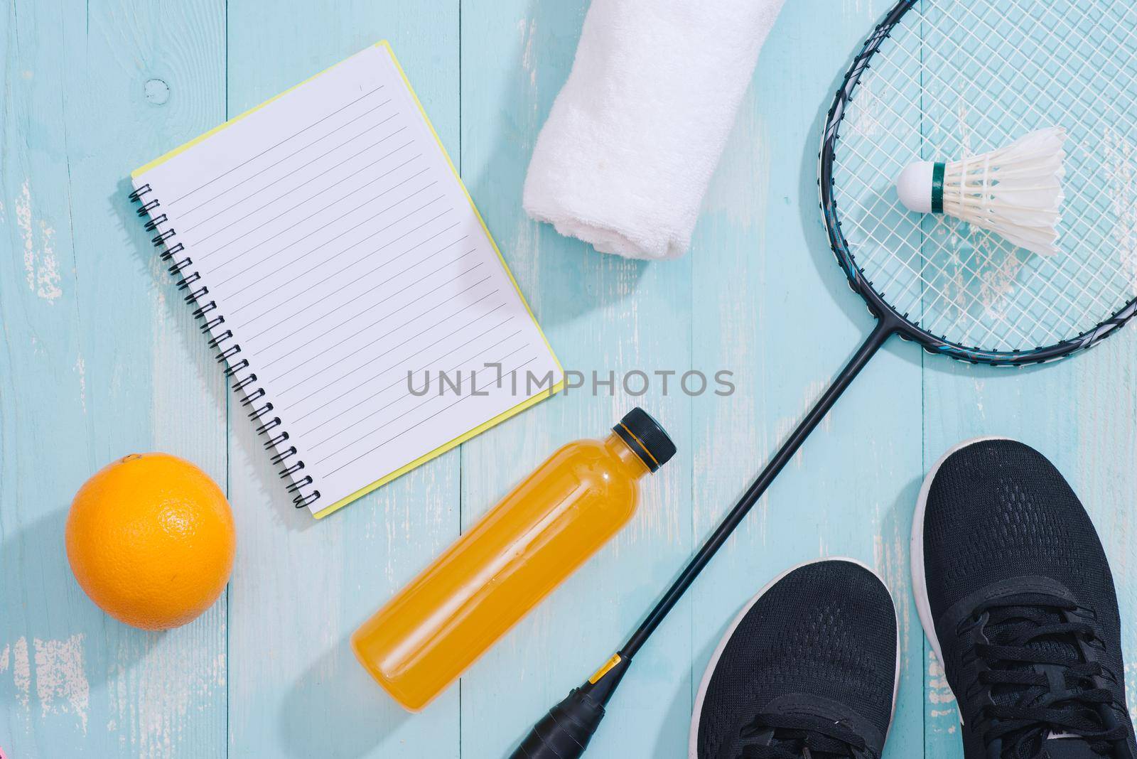 Sport equipment and footwear on wooden background by makidotvn