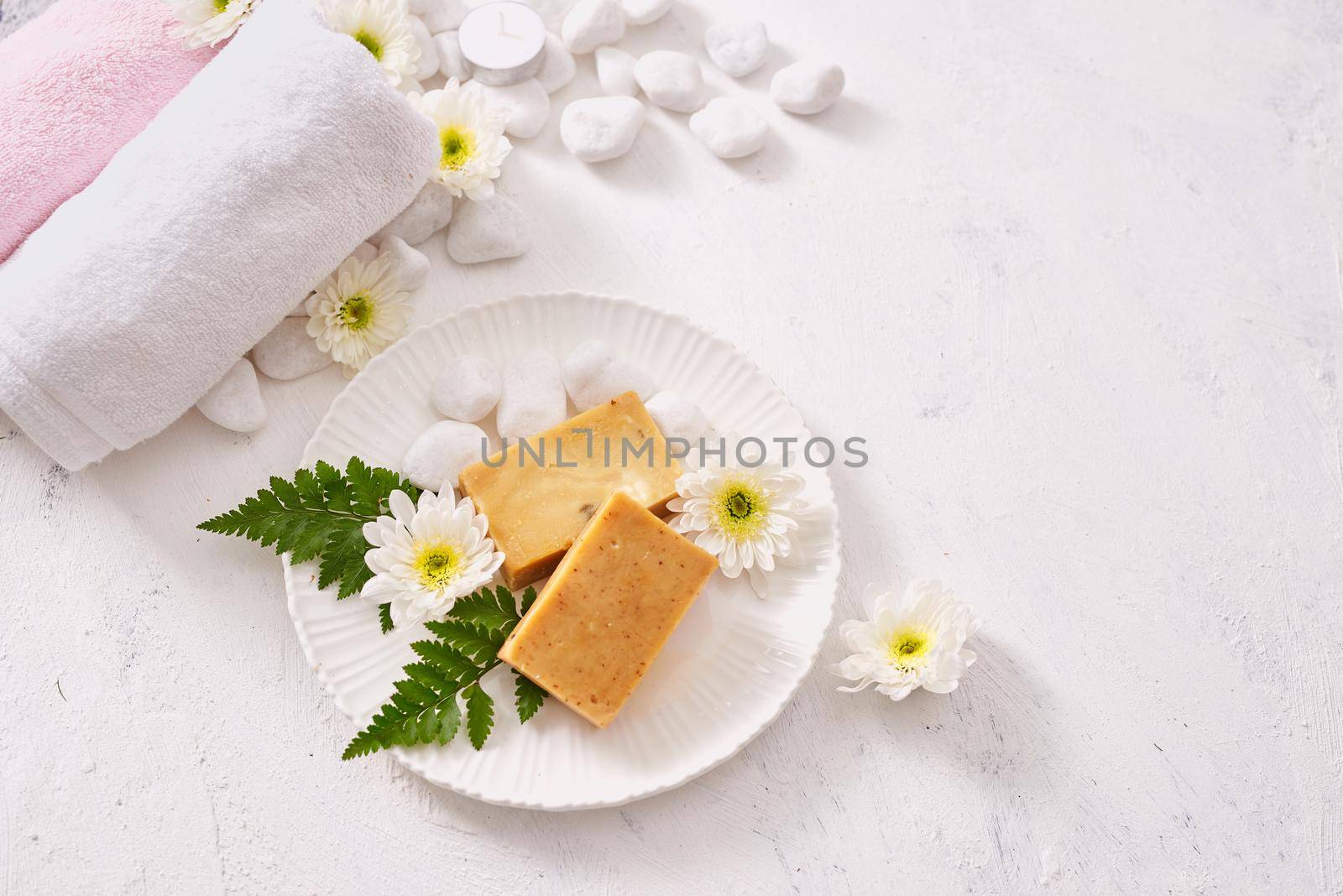 close up of body care cosmetic products on stone table