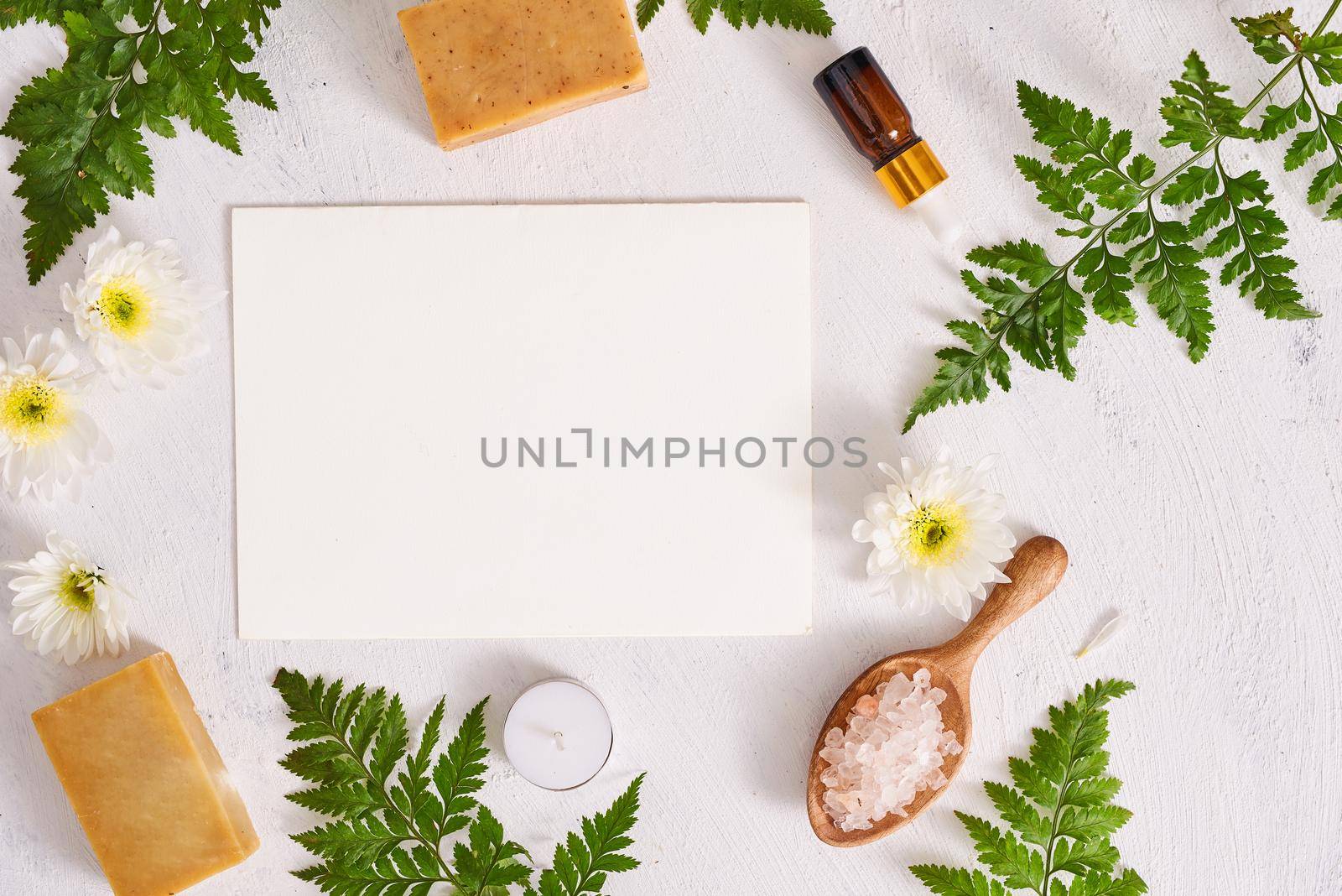 Bathroom salt, soap and aroma oil for spa on white background top view mock-up by makidotvn