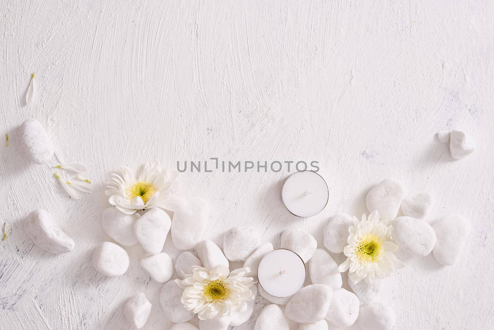 Spa setting with white flower ,candle on stone table