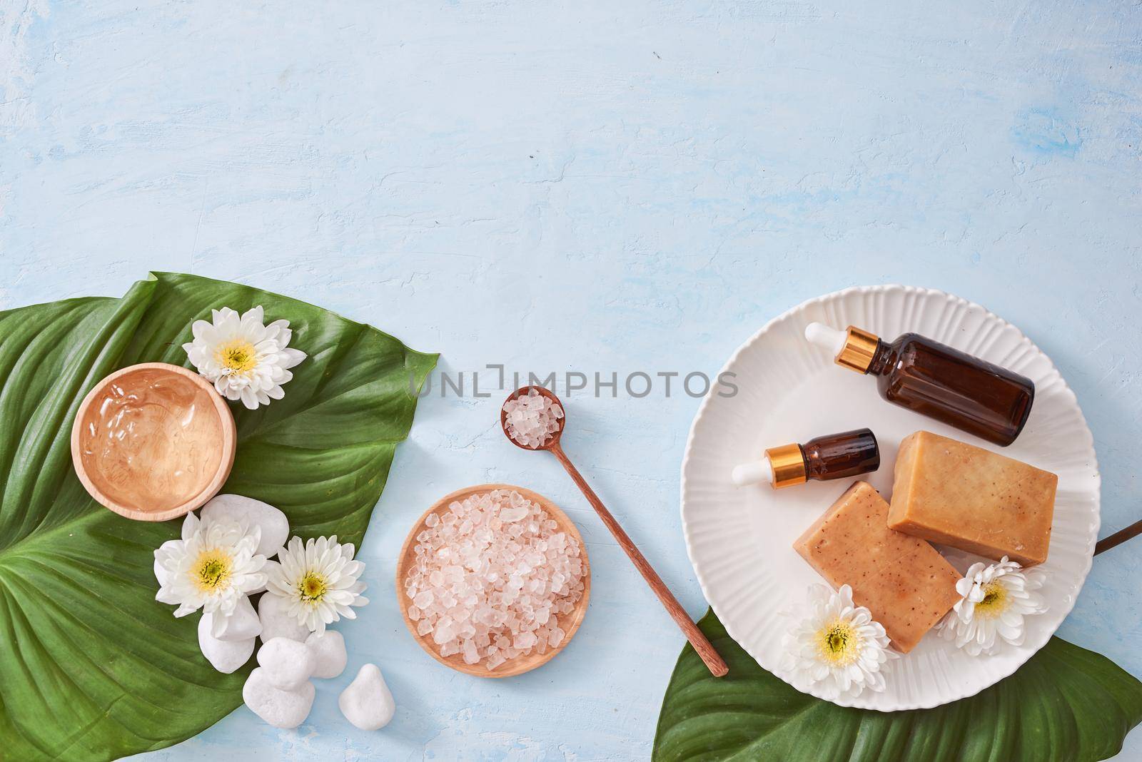 Beauty, spa, body care, bath and natural cosmetics concept - close up of handmade soap bars on white table by makidotvn