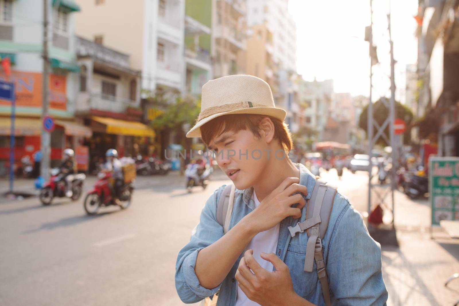 Young Asian traveling backpacker in Cho lon in Chinatown, Saigon
