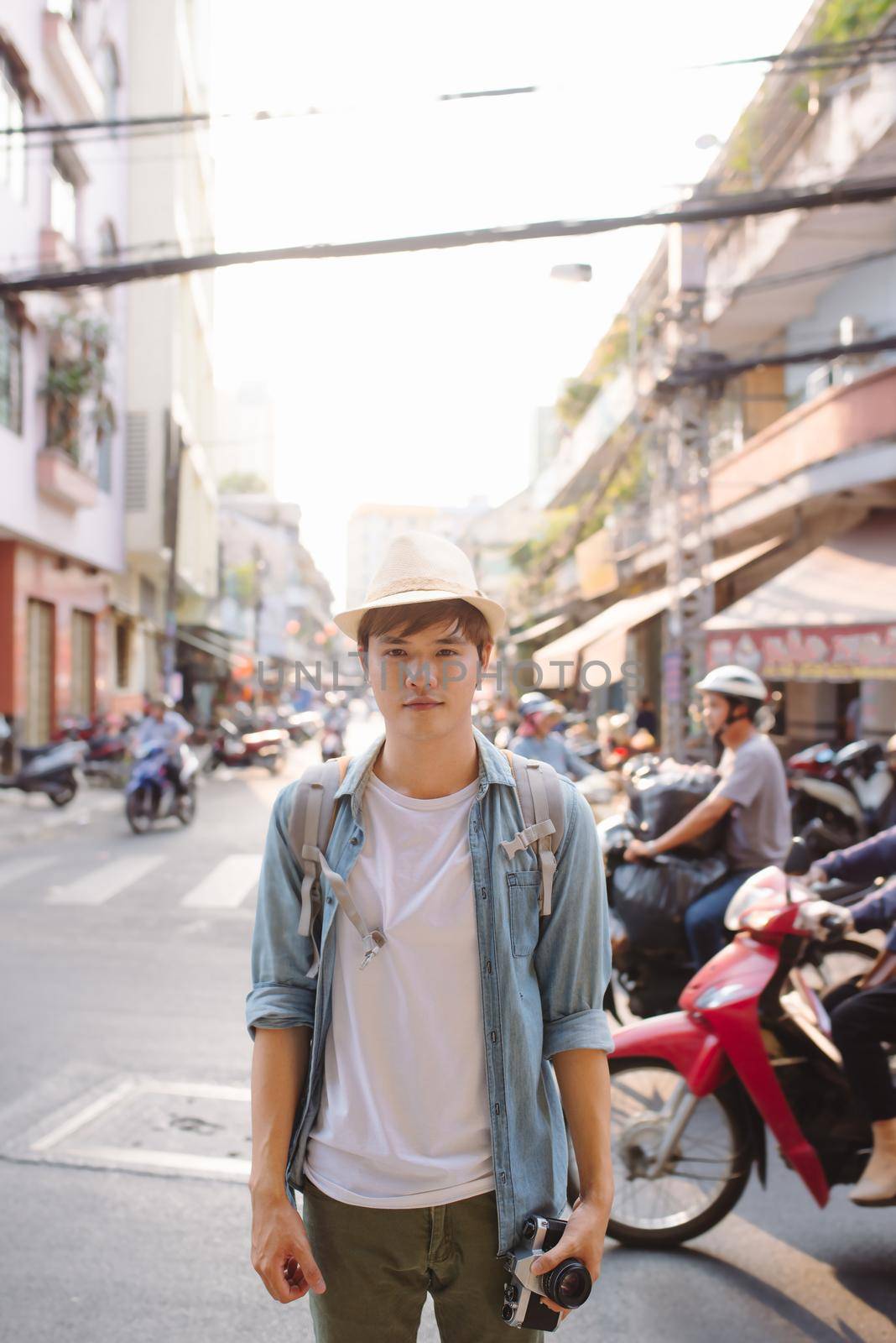 Male tourist backpackers travel summer traveler holidays in the city. by makidotvn