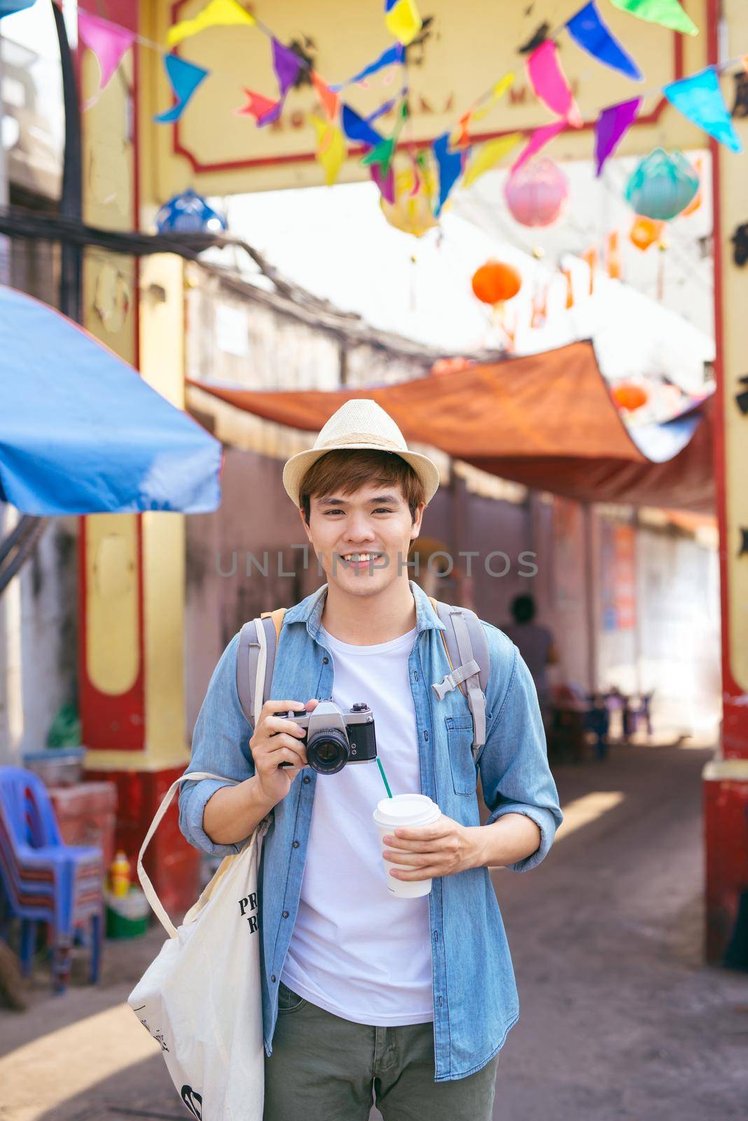 Asian handsome man photographer traveler. Lifestyle concept. by makidotvn