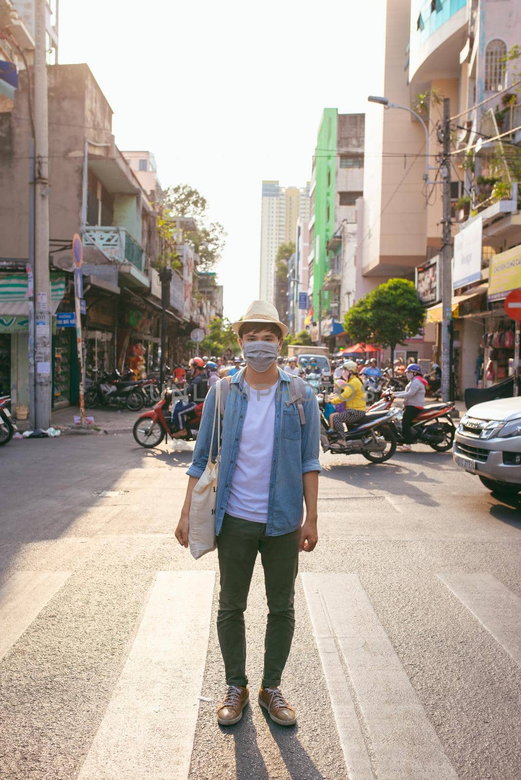 Young Asian man living in city with polluted air by makidotvn