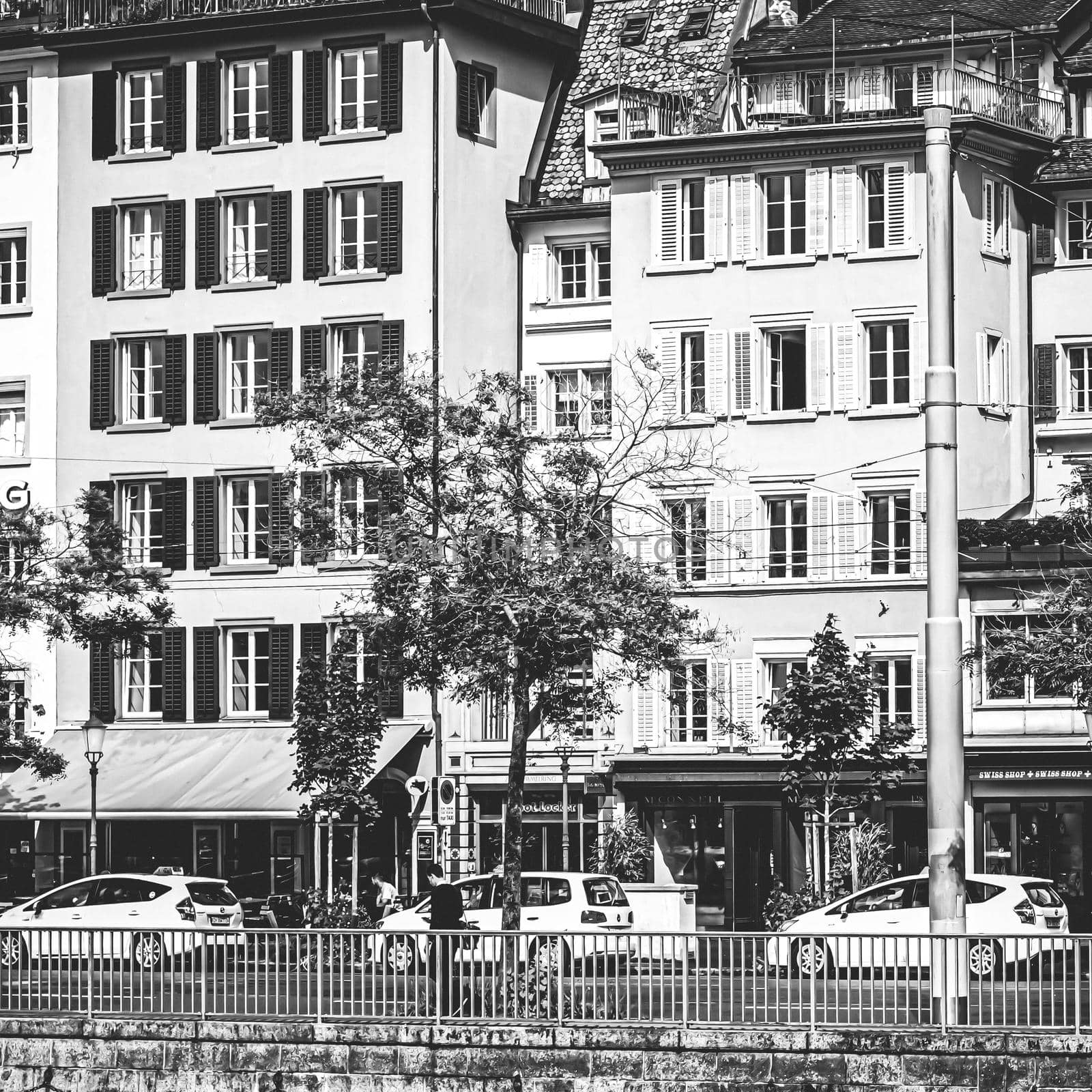 Vintage monochrome view of historic Old Town streets and buildings near main train station Zurich HB, Hauptbahnhof, Swiss architecture and travel destination in Zurich, Switzerland by Anneleven