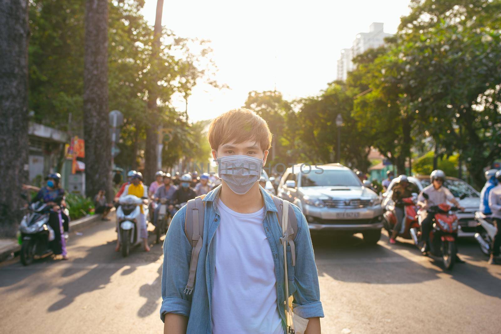 Asian man in the street wearing protective masks by makidotvn