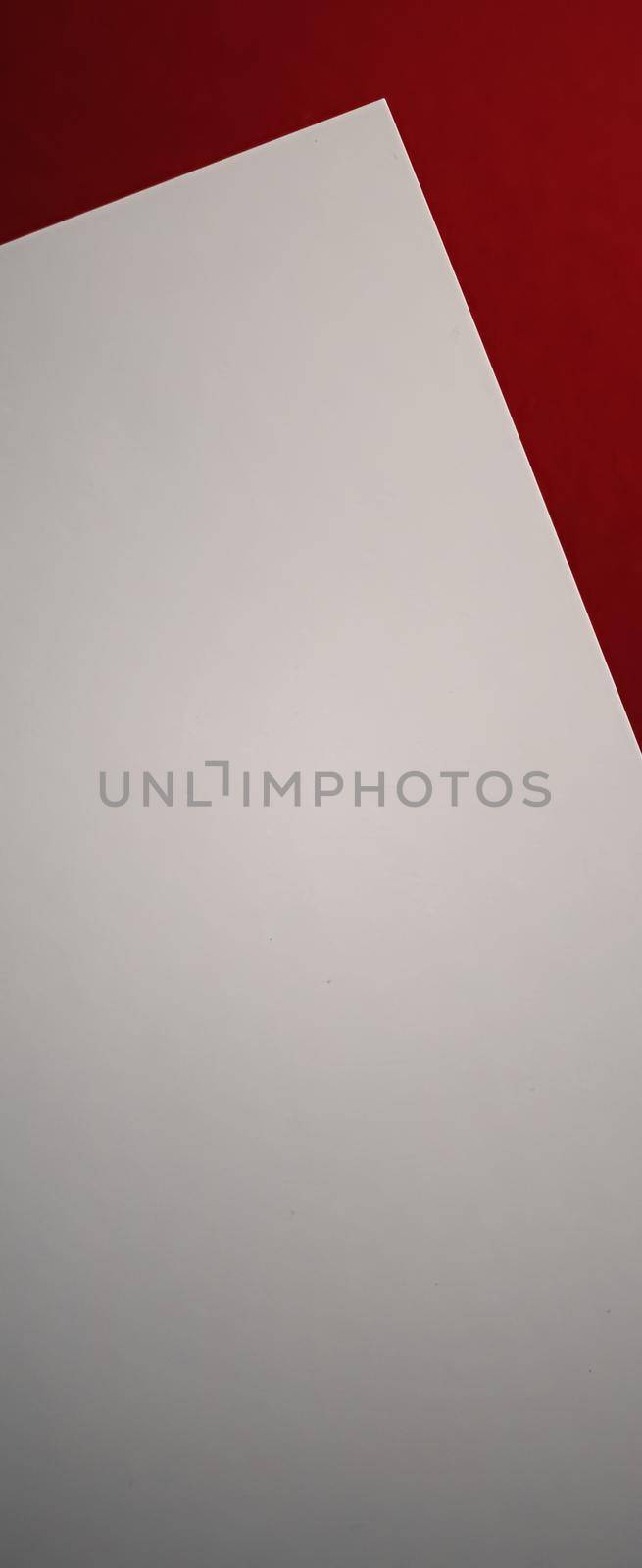 Blank A4 paper, white on red background as office stationery flatlay, luxury branding flat lay and brand identity design for mockup.