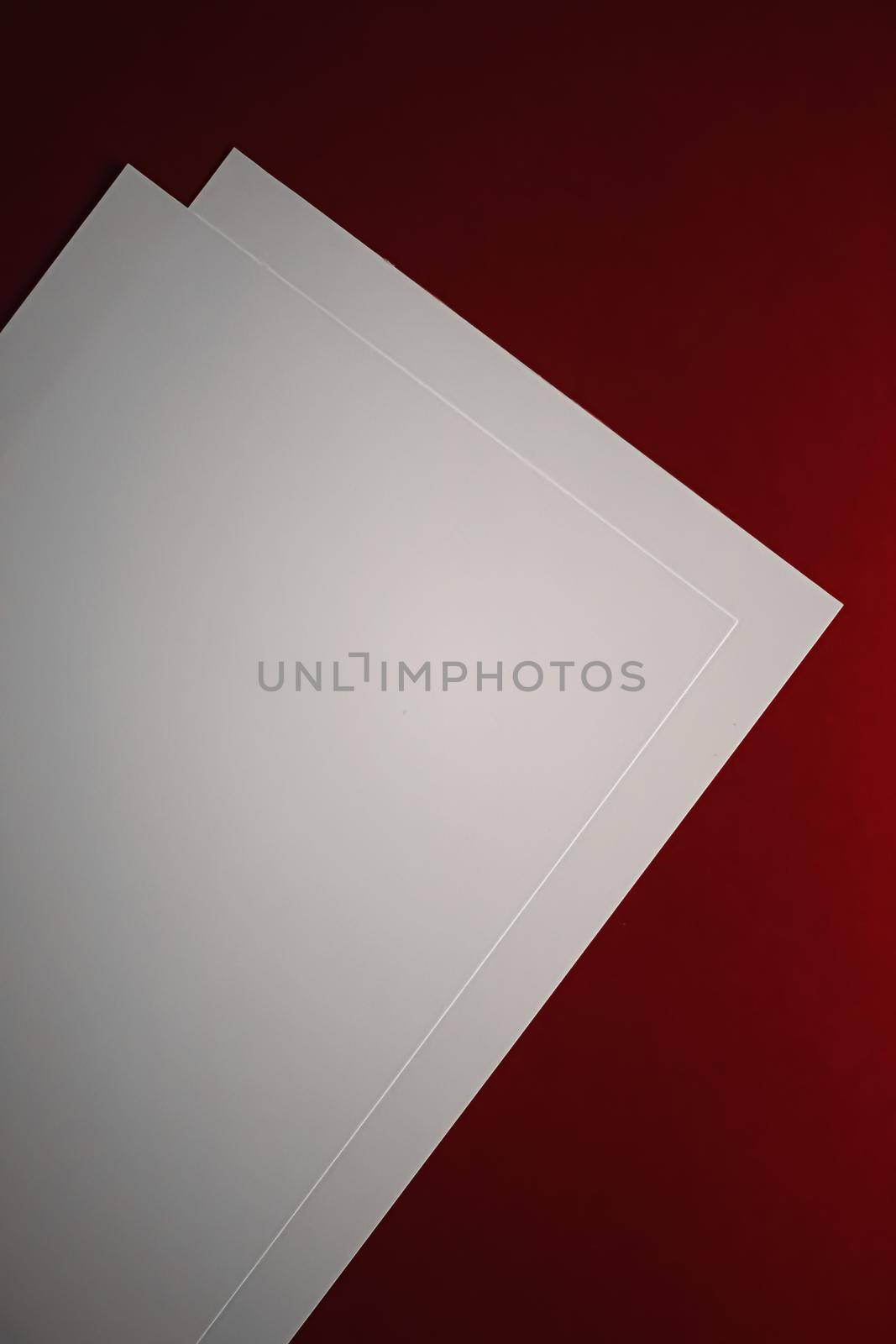 Blank A4 paper, white on red background as office stationery flatlay, luxury branding flat lay and brand identity design for mockup.