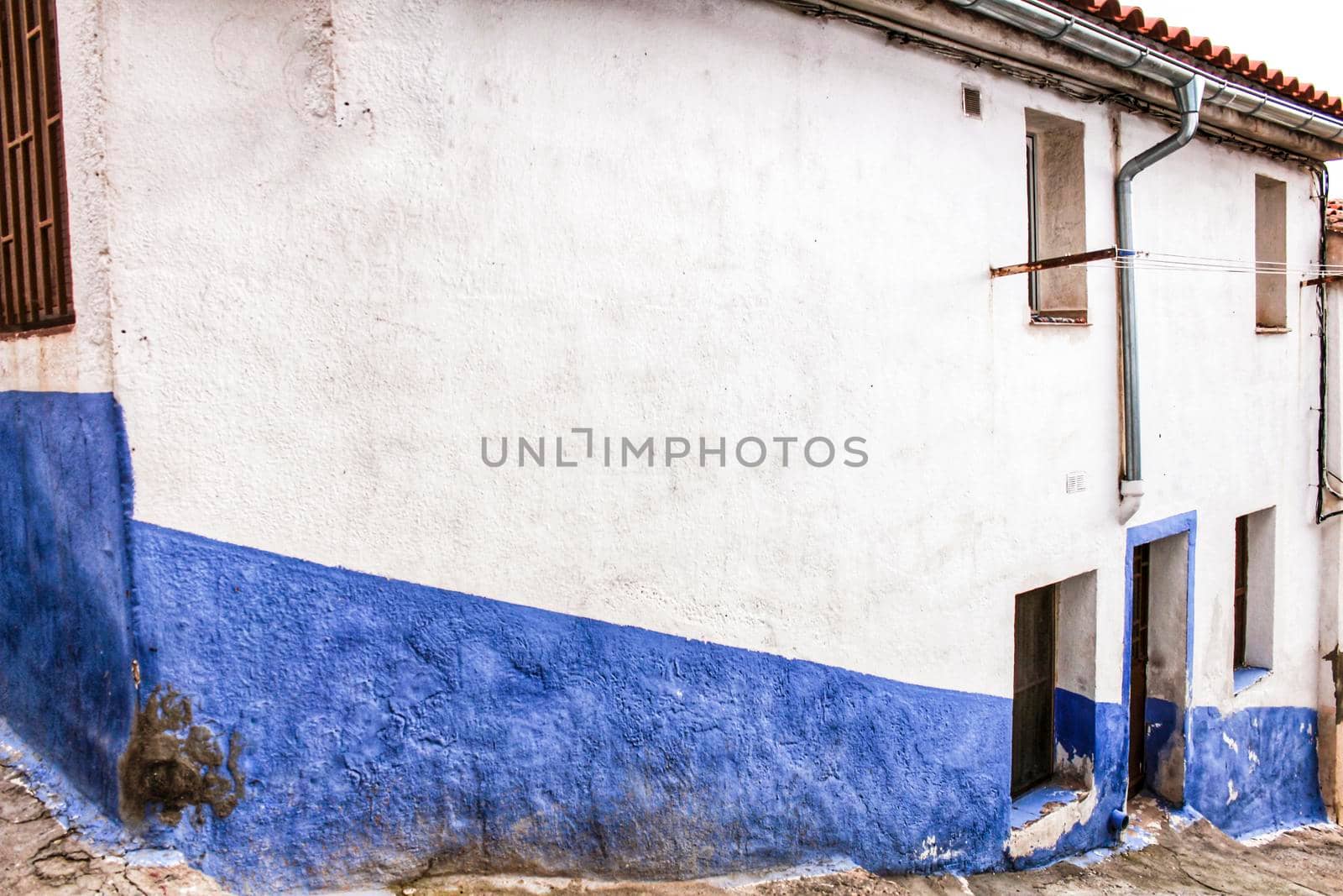 Old facade and streetlight in a small village of Castilla La Mancha community, Spain