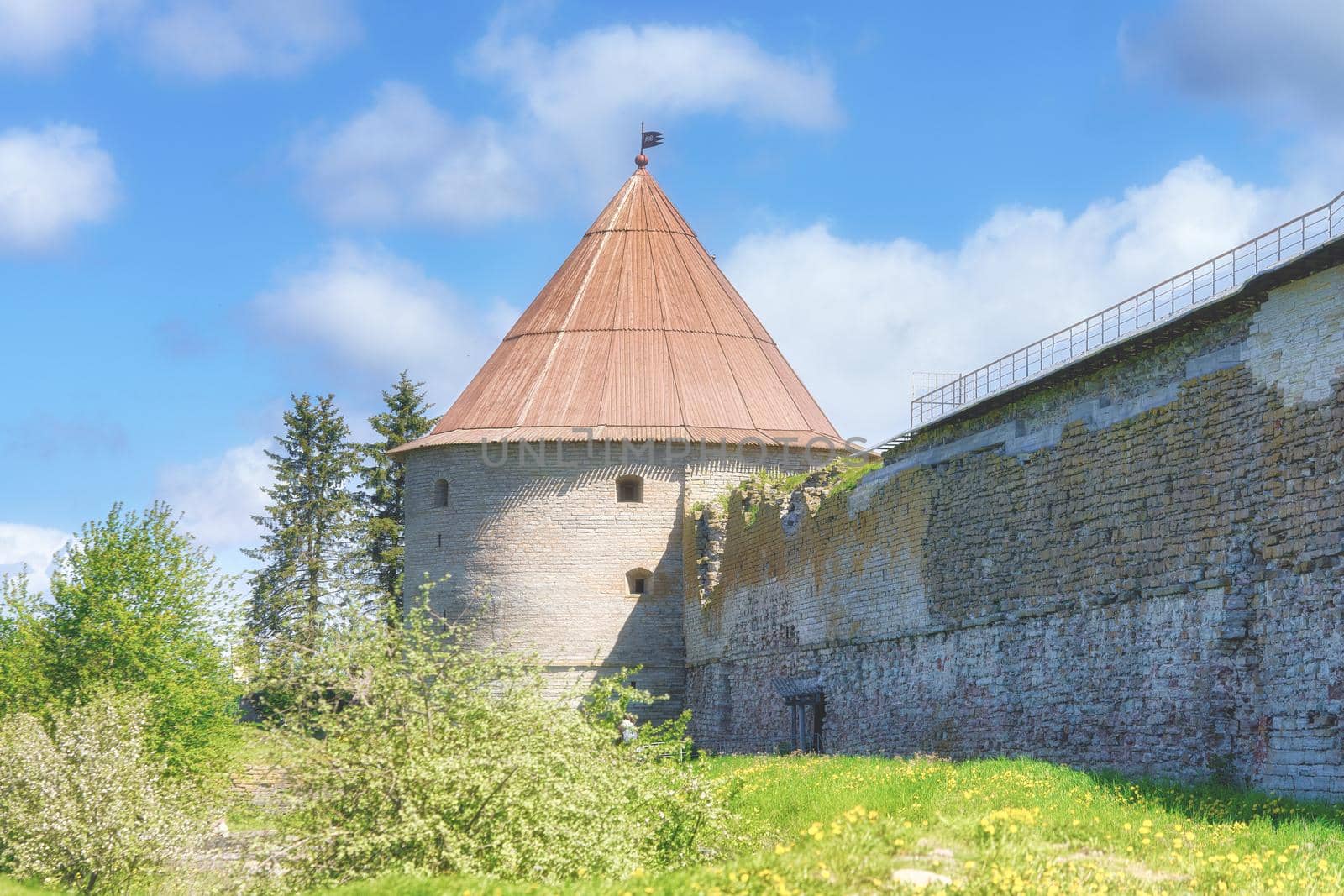 View of the old stone fortress with a watchtower. Fortress Oreshek on a sunny summer day